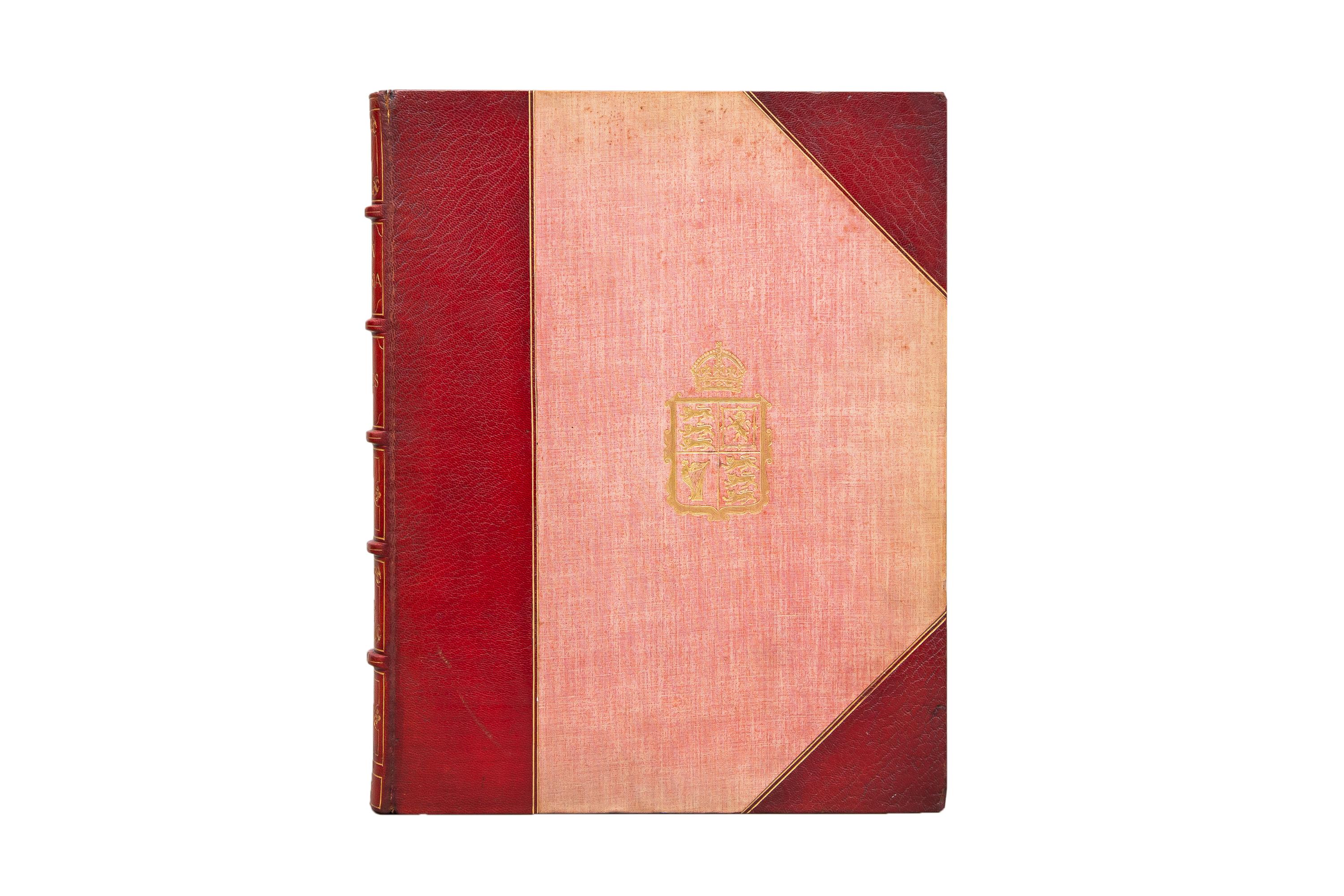 1 Volume. Richard R. Holmes, Queen Victoria. Bound in 3/4 wine morocco and linen boards. The cover displays a crest in gilt. Raised band spine with panels displaying gilt royal detailing and label lettering. The top edge is gilt with marbled