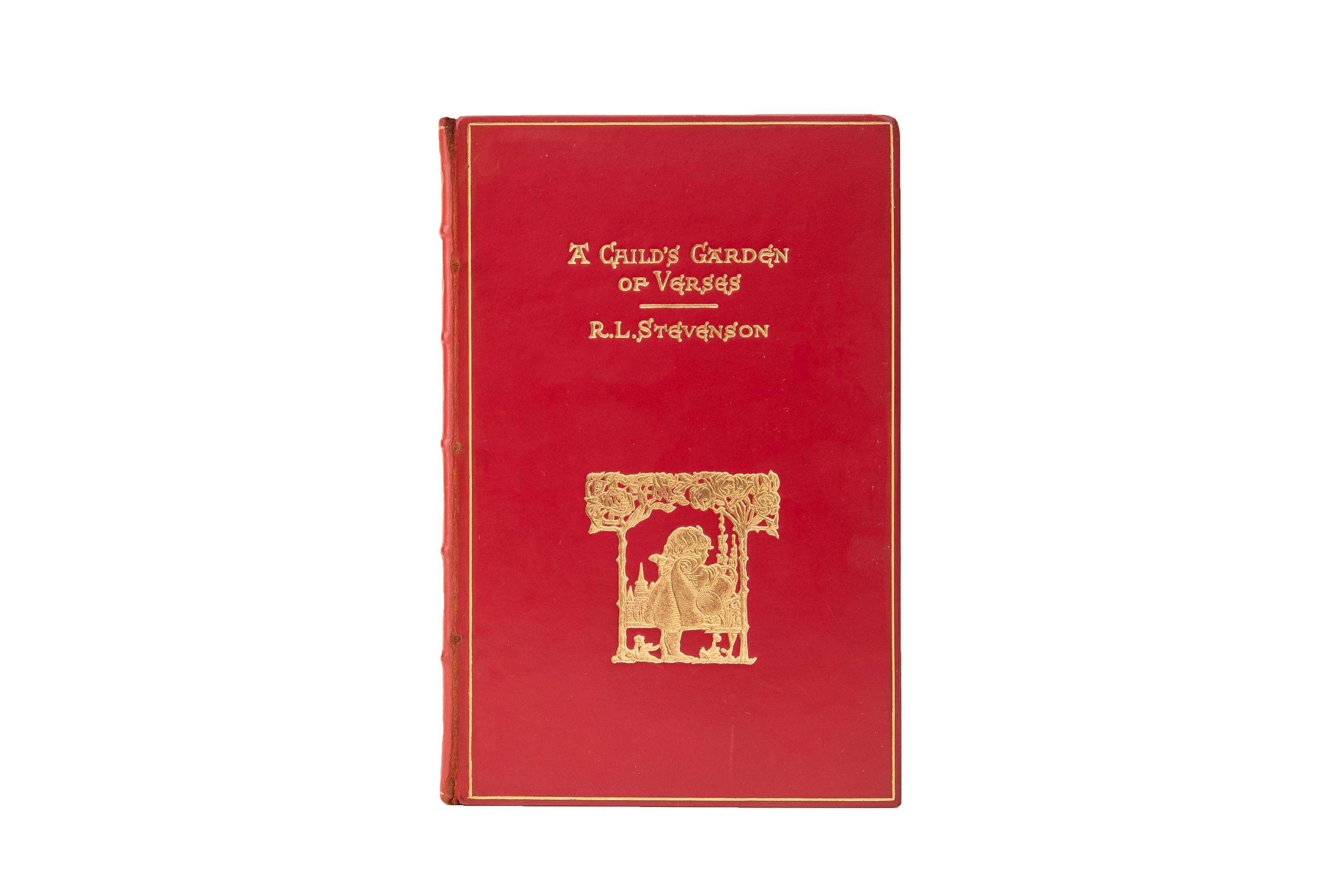 1 Volume. Robert Louis Stevenson, A Child's Garden of Verses. Bound in full red calf with the cover displaying an ornate gilt-tooled scene and title. Raised band spine with gilt-tooled floral detailing. All edges are gilt with gilt-tooled dentelles
