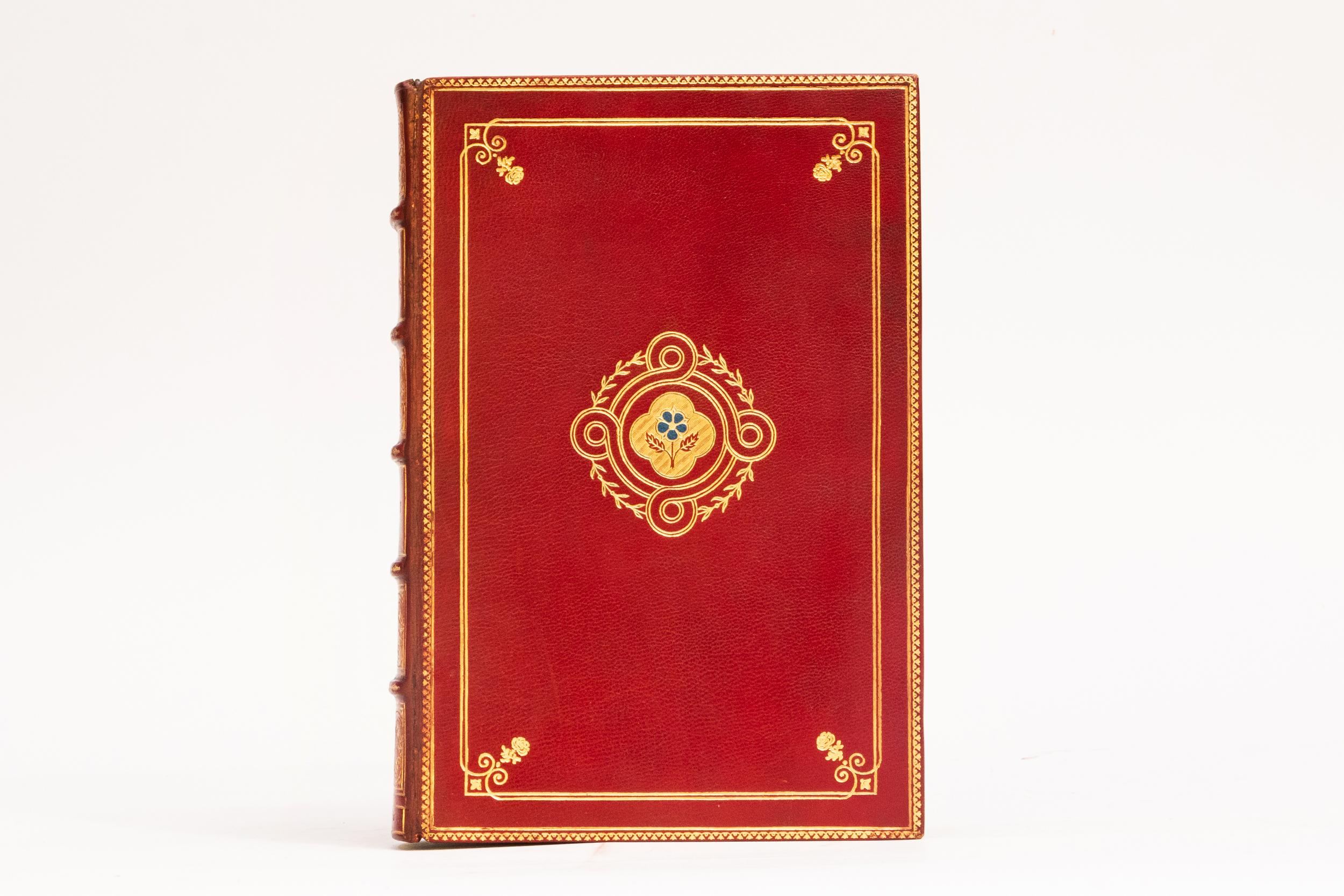 1 Volume. Sir Thomas Malory, Le Morte Darthur. Bound in full red morocco. Blue gilt floral symbol on covers. Raised bands. Decorative gilt floral symbols on spines. Top edges gilt. Cork endpapers. Russel Flint Illus 1927 Fine Bindings. Illustrated.