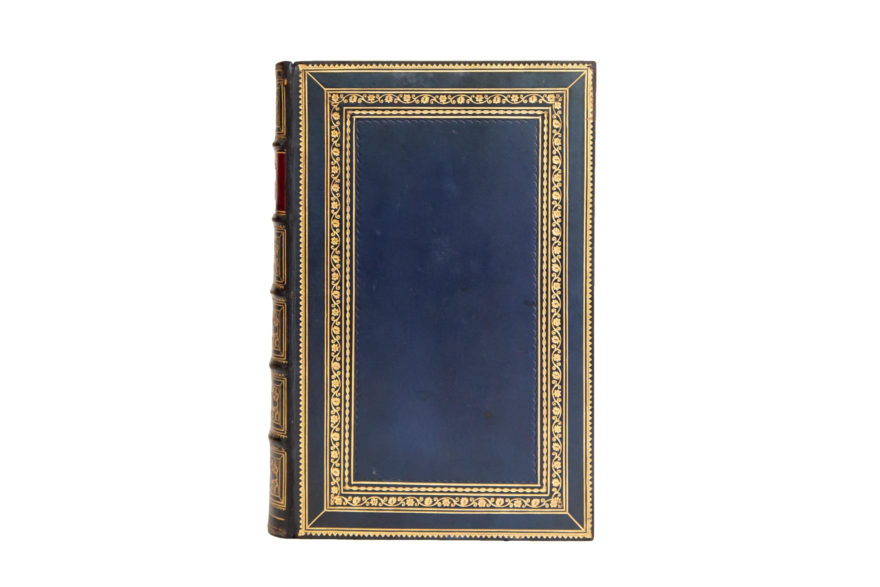 1 Volume. William Wordsworth, Poetical Works. Bound in full blue calf with covers displaying ornate, floral, gilt-tooled bordering. Raised bands, dotted in gilt tooling with panels displaying ornate gilt tooling and labels in red morocco with