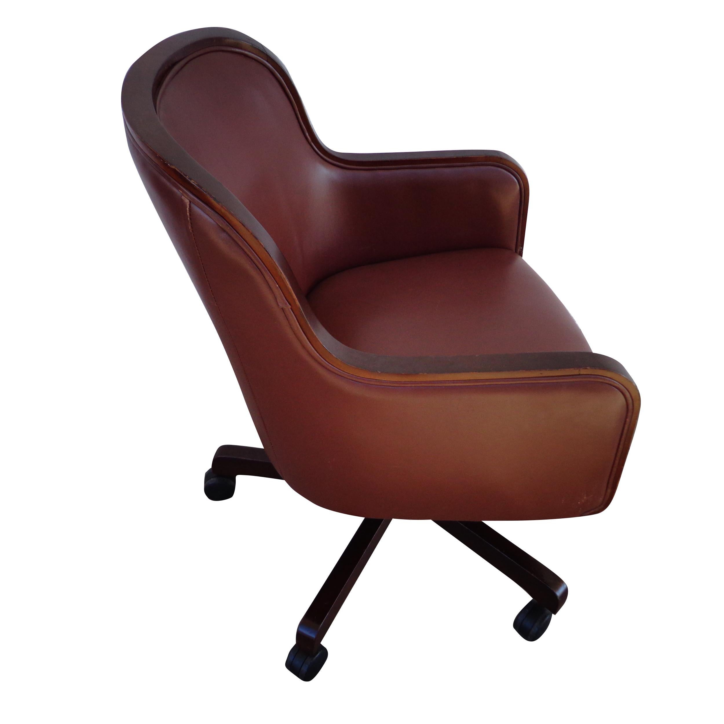  Ward Bennett for Brickel and Associates Barrel-Back leather desk chair 6 available 


 4-star anodized bronze base swivel conference room chair in a brown leather with walnut trim.

Chair swivels and is height adjustable. Six available.