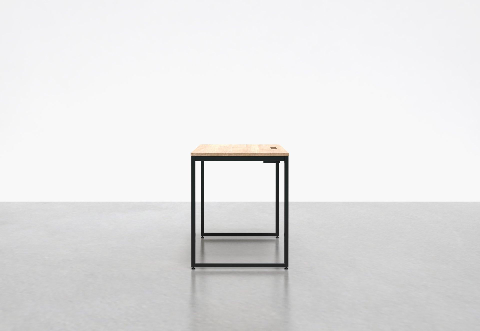 Inspired by the concept of an architect's desk, our minimal 1 x 1 desk has box legs and is perfect in your home office or at the office. The 1 x 1 desk comes equipped with a built-in compartment that holds power-strips and helps conceal cables.