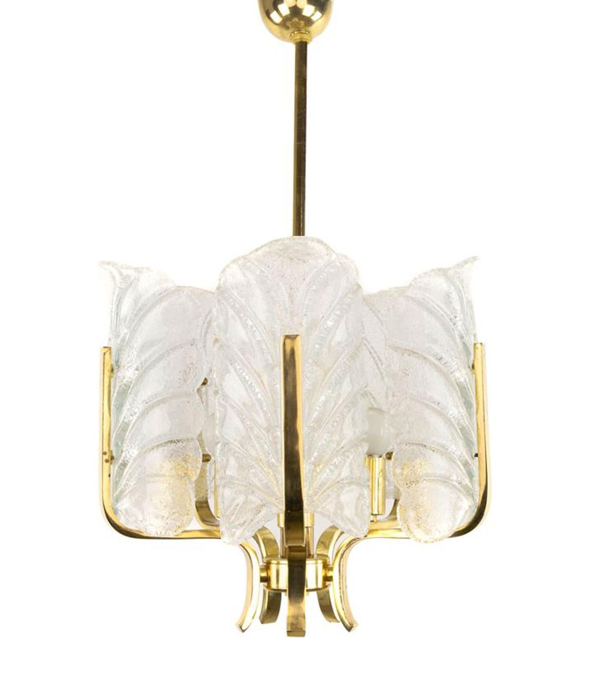 A mid-century ceiling light with 5 brass arms and crystal glass leaf light diffusers. Designed by Carl Fagerlund and manufactured by Orrefors of Sweden in the 1960s. Hollywood Regency style. The frosted glass leaves omit a wonderful glow, and this