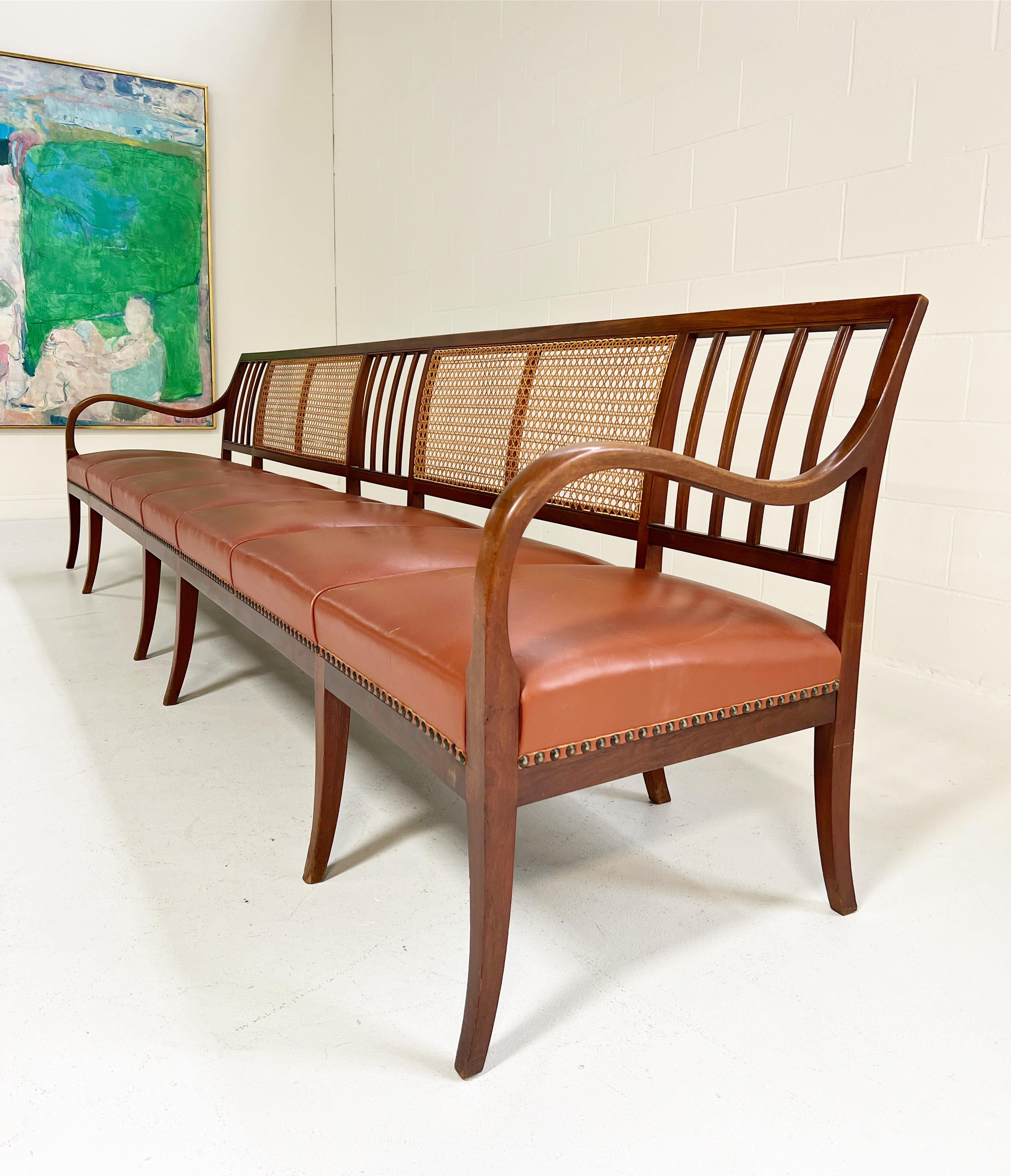Danish Frits Henningsen Cane, Mahogany, and Leather 10 1/2 Ft Bench For Sale