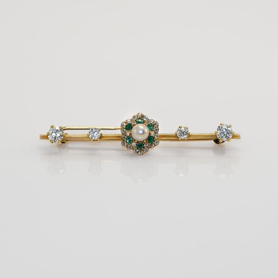 Antique pin with diamonds, emeralds and pearl in yellow gold.

Using an X Ray gun the gold tests 48.5% pure.

Which is between 10k and 12k gold.

The largest four diamonds are old-Euro cuts, 2 x .30ct and 2x .12ct, H, i, j color range Si
