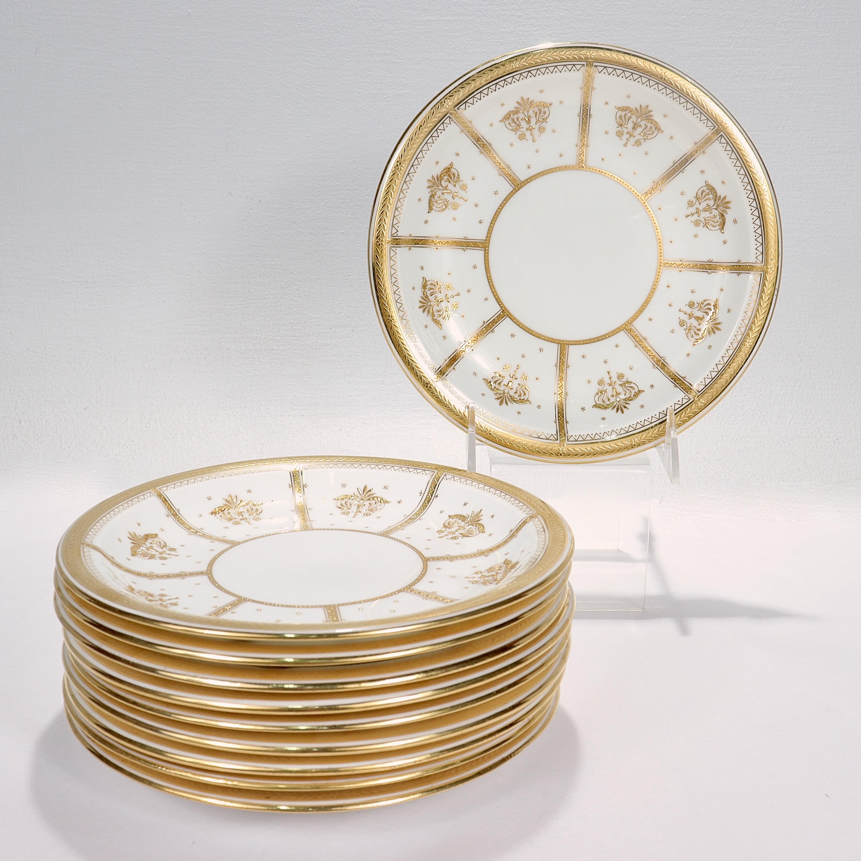A set of 10 richly gilt porcelain luncheon or dessert plates.

By Mintons.

In an Aesthetic Movement numbered pattern with raised gold and gold jeweling throughout.

Each marked to the base with a puce maker's mark that reads 58013 / E / Rd. No.