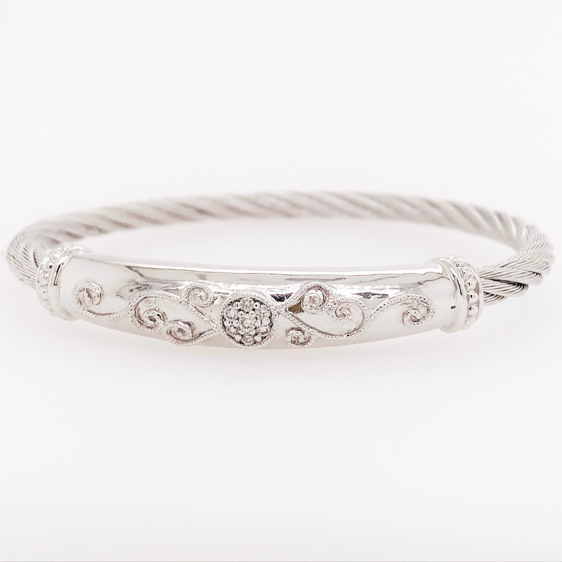 This modern diamond bangle bracelet is a unique, seamless design with natural round brilliant diamonds. The bracelet band is a stainless steel, twisted cable band that is attached to a sterling silver tube with a diamonds design on top. The top has