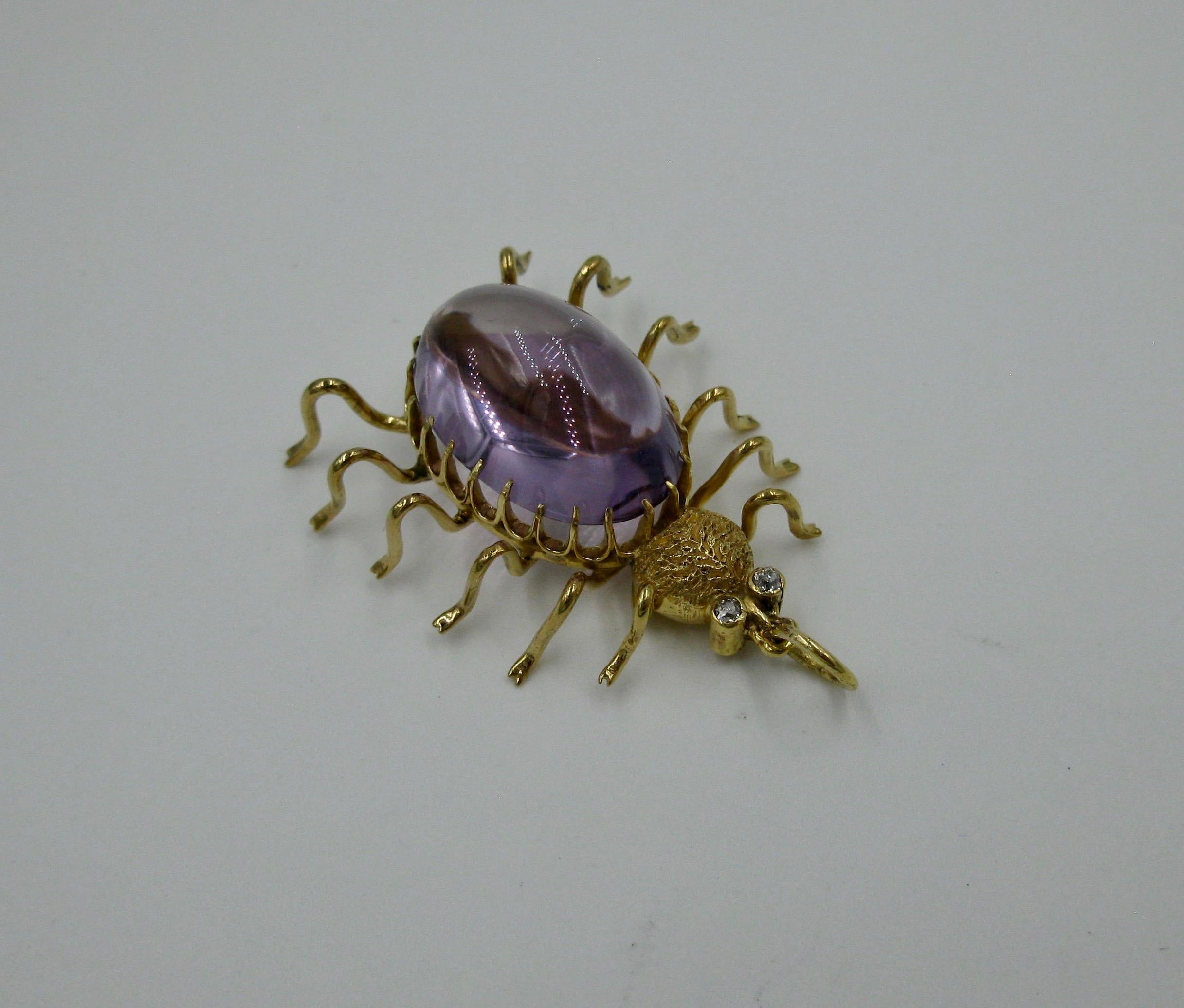 This is a wonderful Amethyst Diamond Spider Pendant!  The vintage modernist spider is set with a 10 Carat oval cabochon Amethyst of great beauty.  The Amethyst is a stunning purple gem.  The spiders eyes are round Diamonds.  The jewels are set in 10