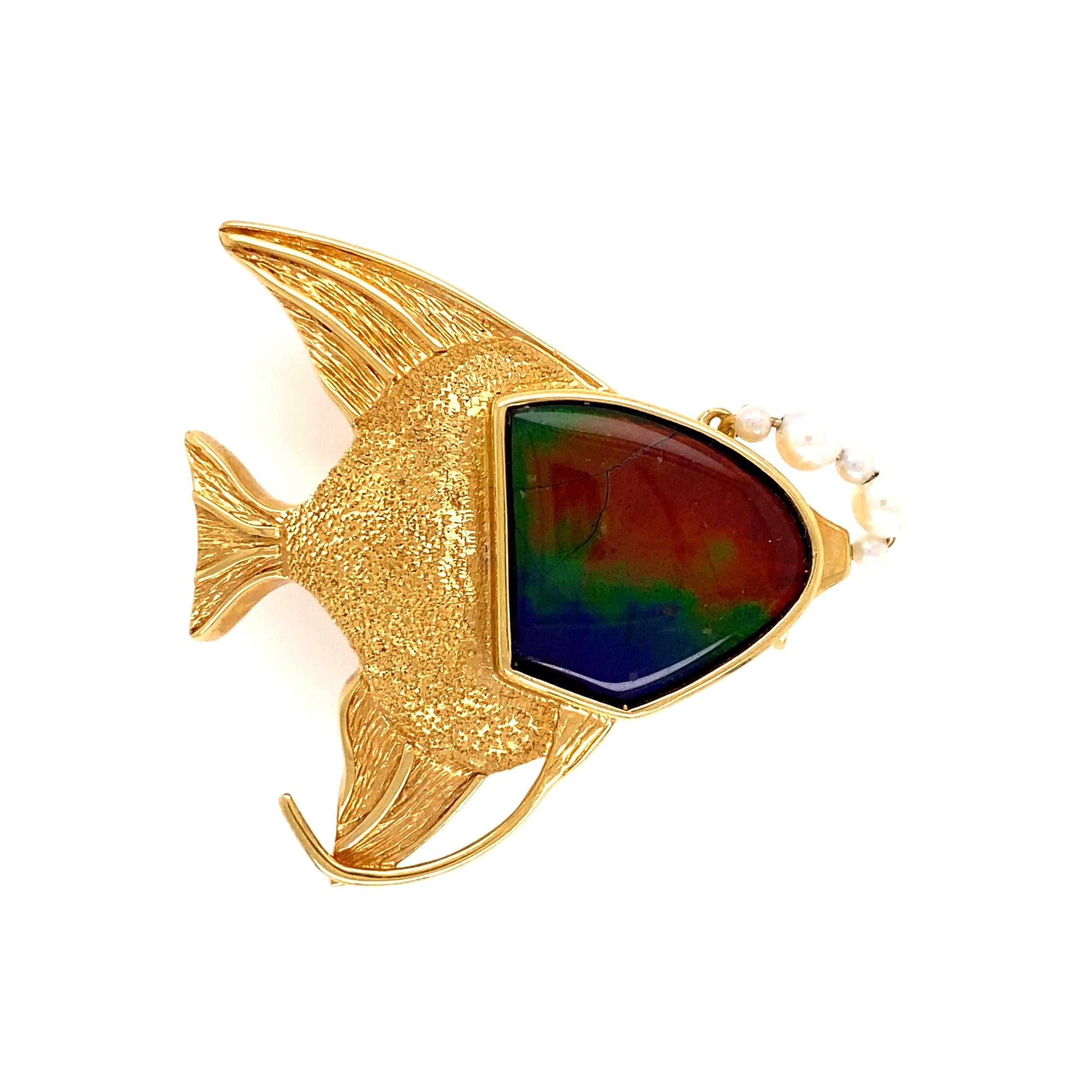 Awesome Gold Fish Pendant. Hand set with an Ammolite, weighing approx. 10 Carats, accented by Pearls. Hand crafted in 18K Yellow Gold. Measuring approx. 1.5