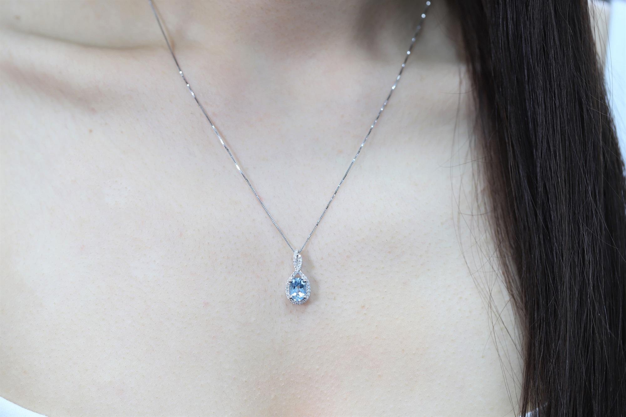 Decorate yourself in elegance with this Pendant is crafted from 10-karat White Gold by Gin & Grace Pendant. This Pendant is made up of 6X8 Oval-Cut Prong setting Genuine Aquamarine (1 Pcs) 1.0 Carat and Round-Cut Prong setting Natural White Diamond