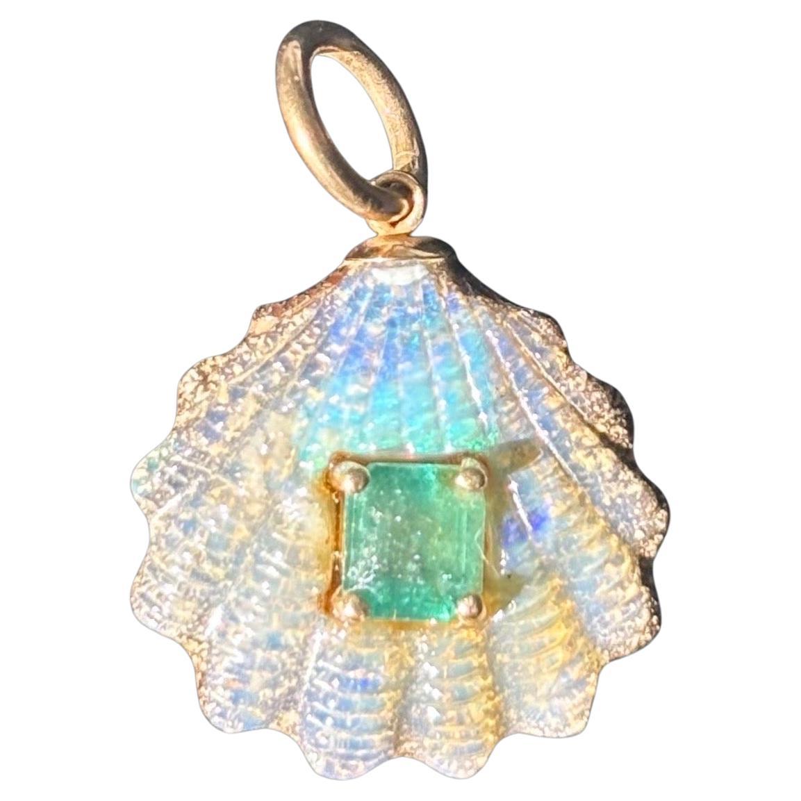 Australian Opal Shell Pendant

Australian Opal, Emerald, 14k Gold

Carved Australian Opal, 20mm diameter with center 6x5mm emerald. 

The thick gold ring bail can accommodate a chain, cord and beaded necklace up to 5mm in width. 

This opal was