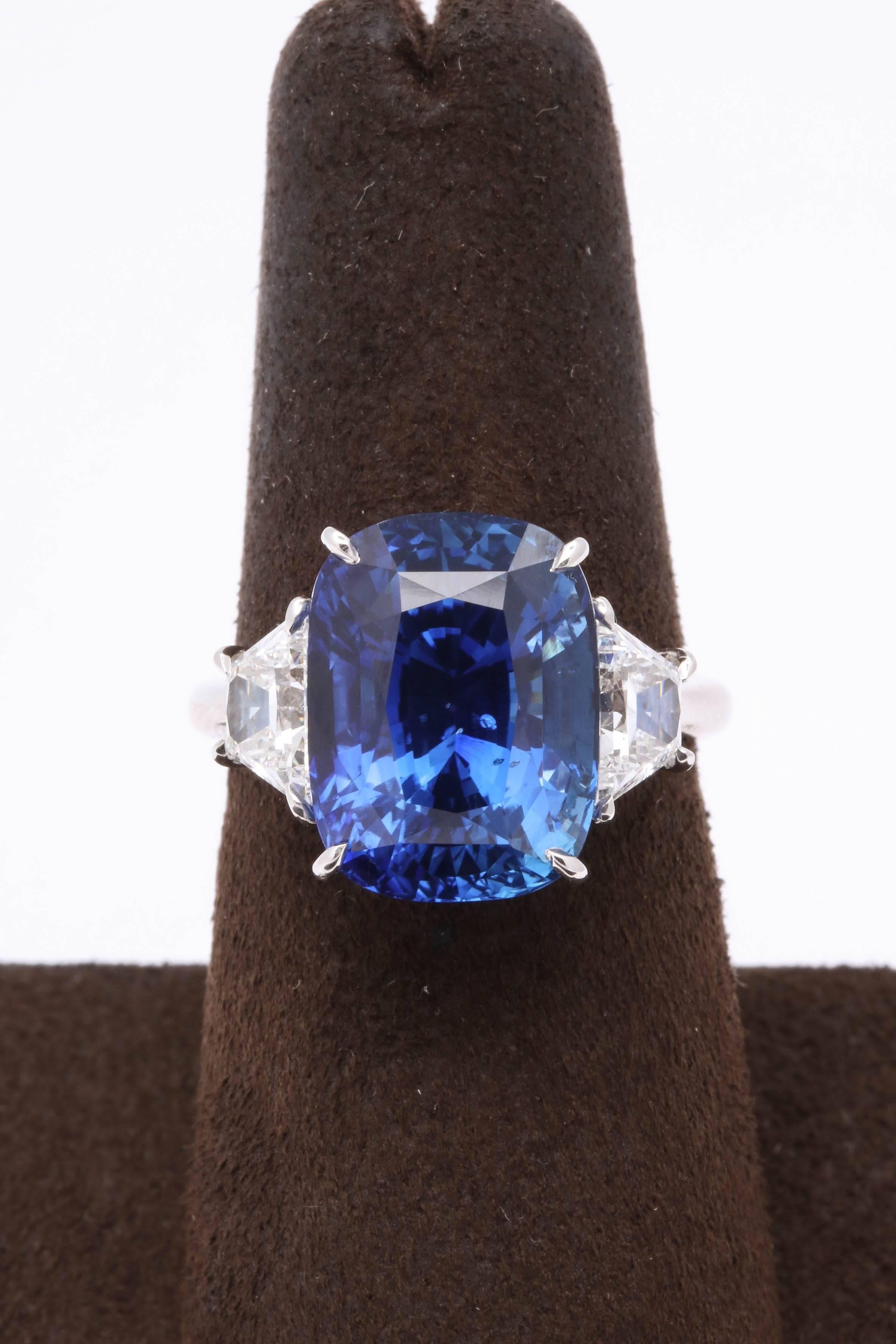 
A gorgeous sapphire with Ceylon Blue color -- the perfect cushion shape!

10.80 carats certified blue sapphire 

1.07 carats of white side diamonds

Handmade in platinum 

The ring is currently a size 6 but can be sized to any finger size. 

The