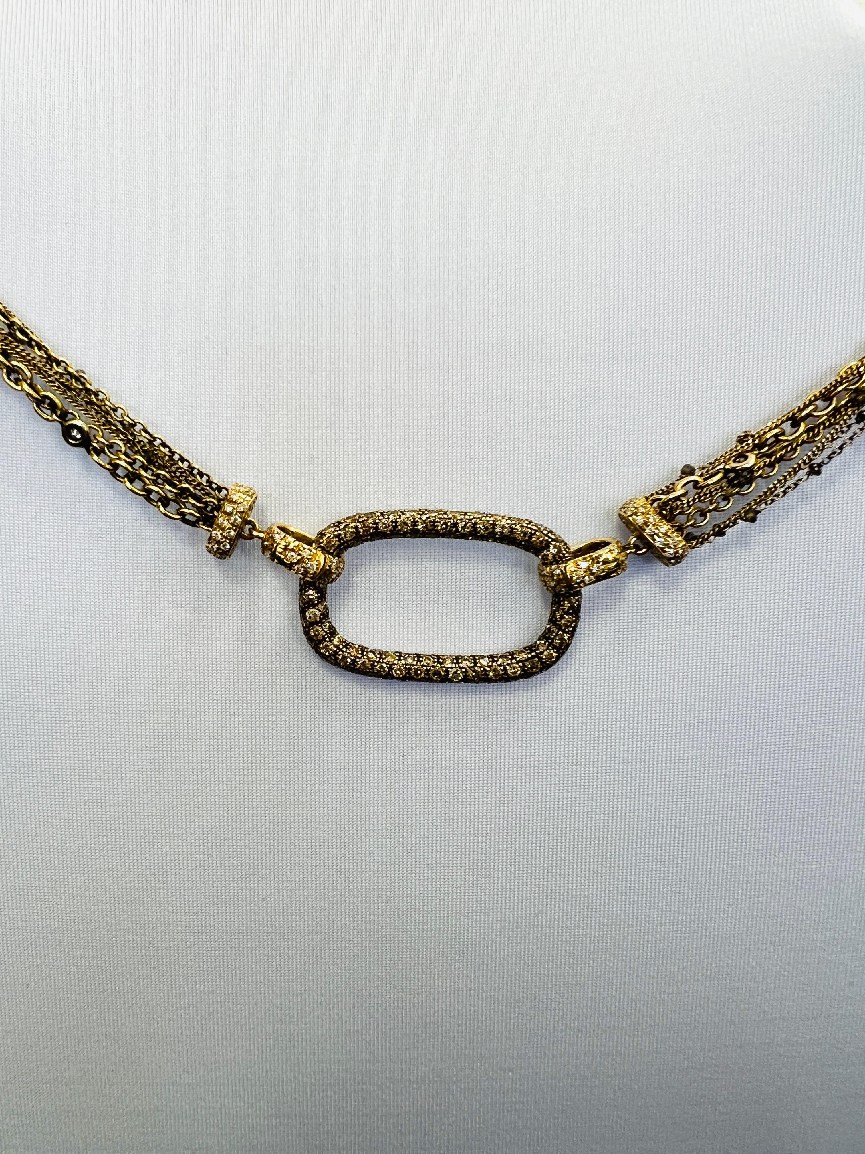Beautiful 10.00 ct. champagne rounds and white diamond briolette.  handmade in 18k yellow gold.  Length is 34