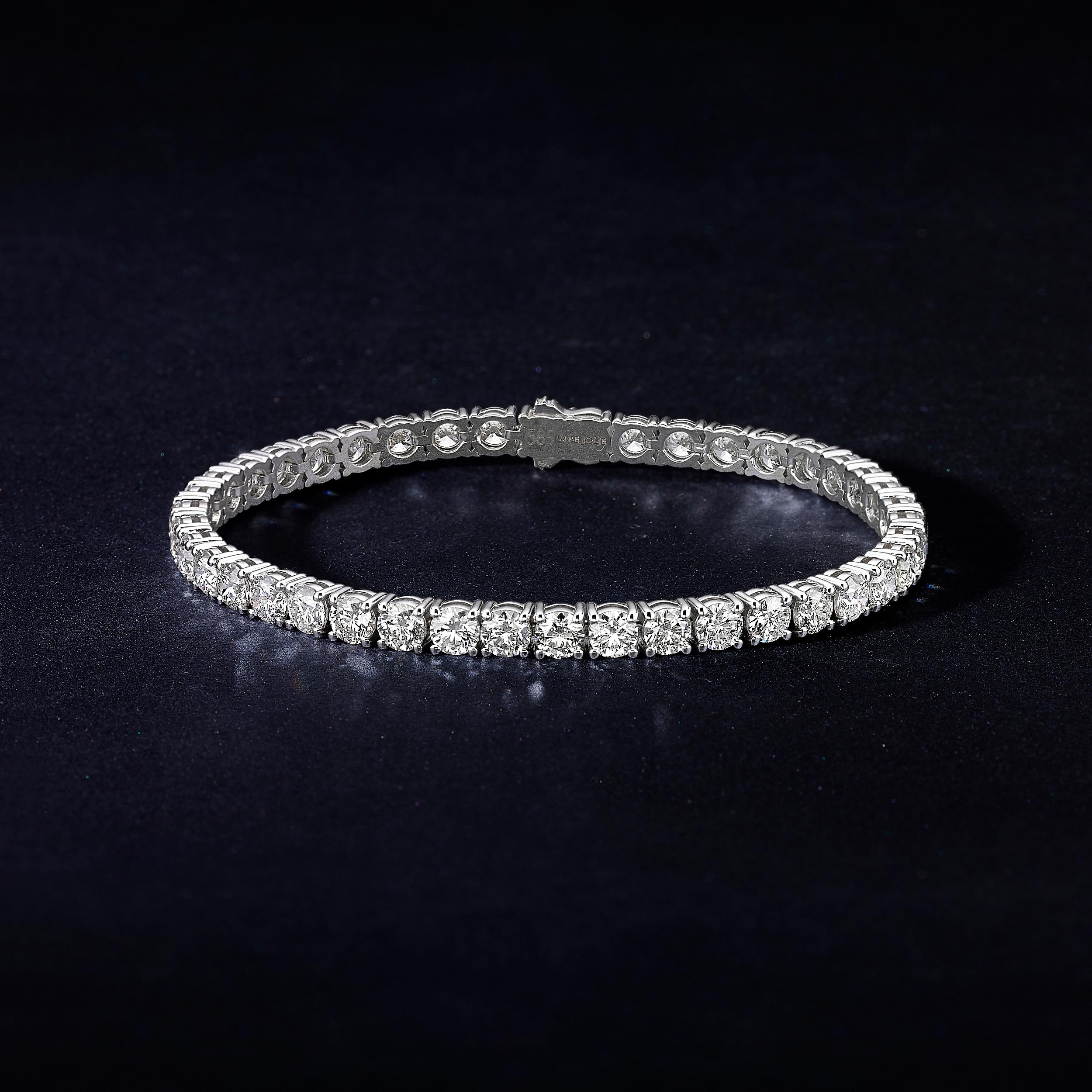 Classic 10 Carat tennis bracelet is a piece of jewelry that will grace the hand of a special woman.
The bracelet features 42 dazzling round cut diamonds and mounted on 14K white gold. The handmade bracelet is done with precise goldsmith work. The