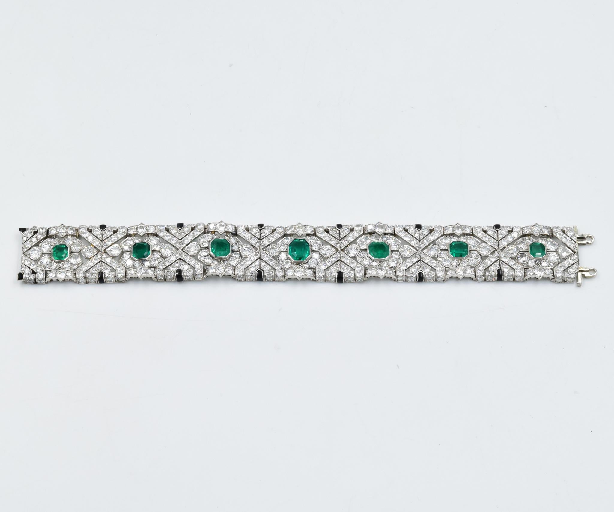 This estate Art Deco 1920's diamond bracelet features a suite of seven fine quality Colombian emeralds which have been certified by AGL.  The emeralds do range in size with a rectangular or square step cut giving it a very unique appeal.  This