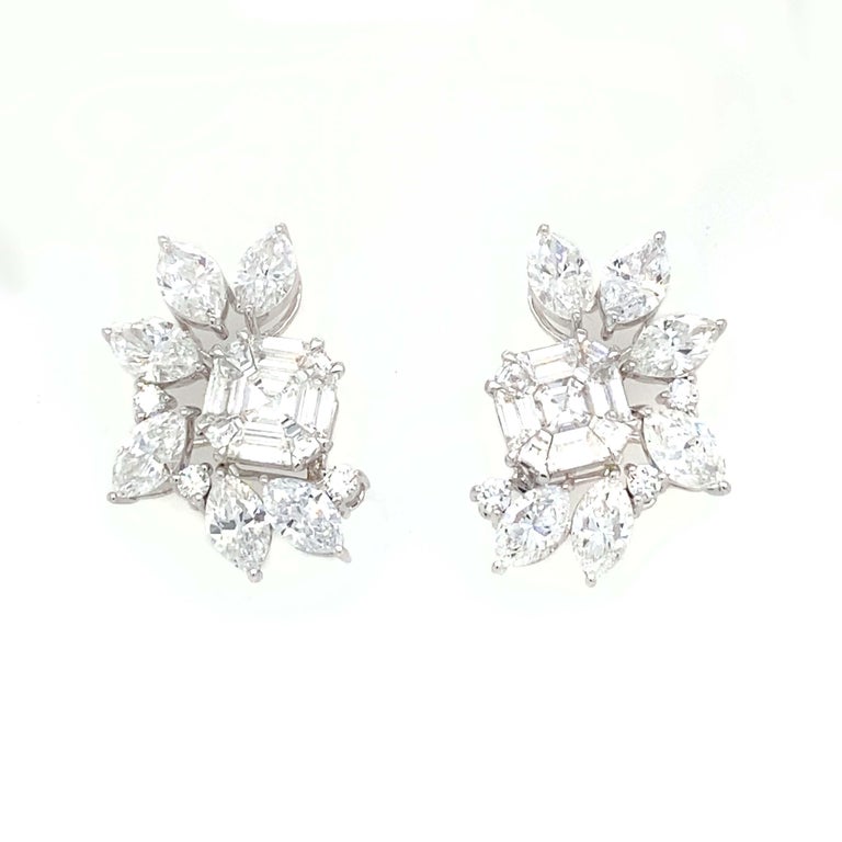 These beautiful diamond earrings are perfect for winter. The nestle right into the shape of the ear, looking brilliant and natural. The center square is a cluster of diamonds. The outer marquise diamonds create a unique one-of-a-kind look for