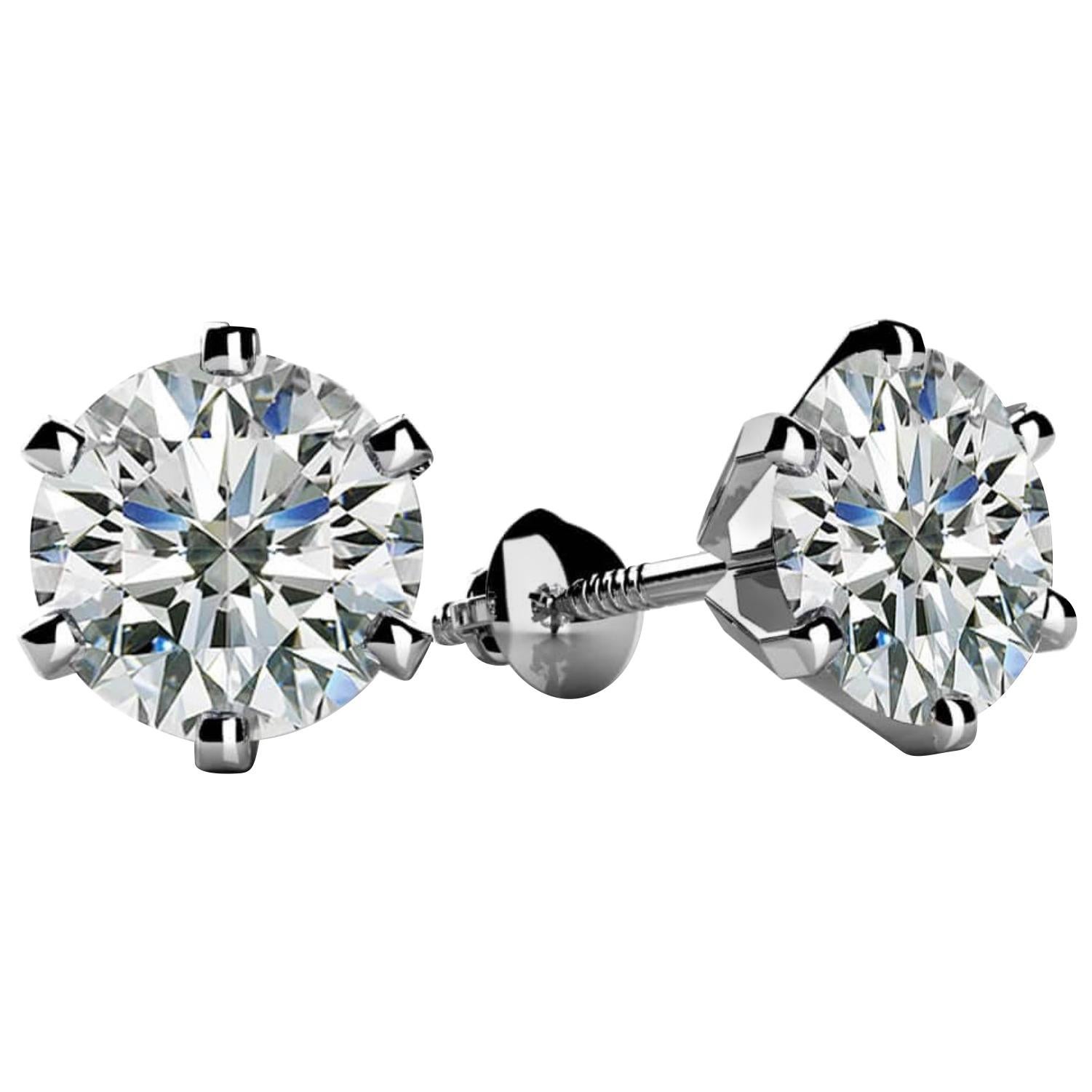 A sweet, shimmery style for any day of the week. These stud earrings 50 pointer Solitaire round brilliant-cut diamonds. 
Set in 14 kt Yellow gold. Post, Screw back diamond  stud earrings.
Best For Every day , home and work 
Total Diamond weight 1 ct