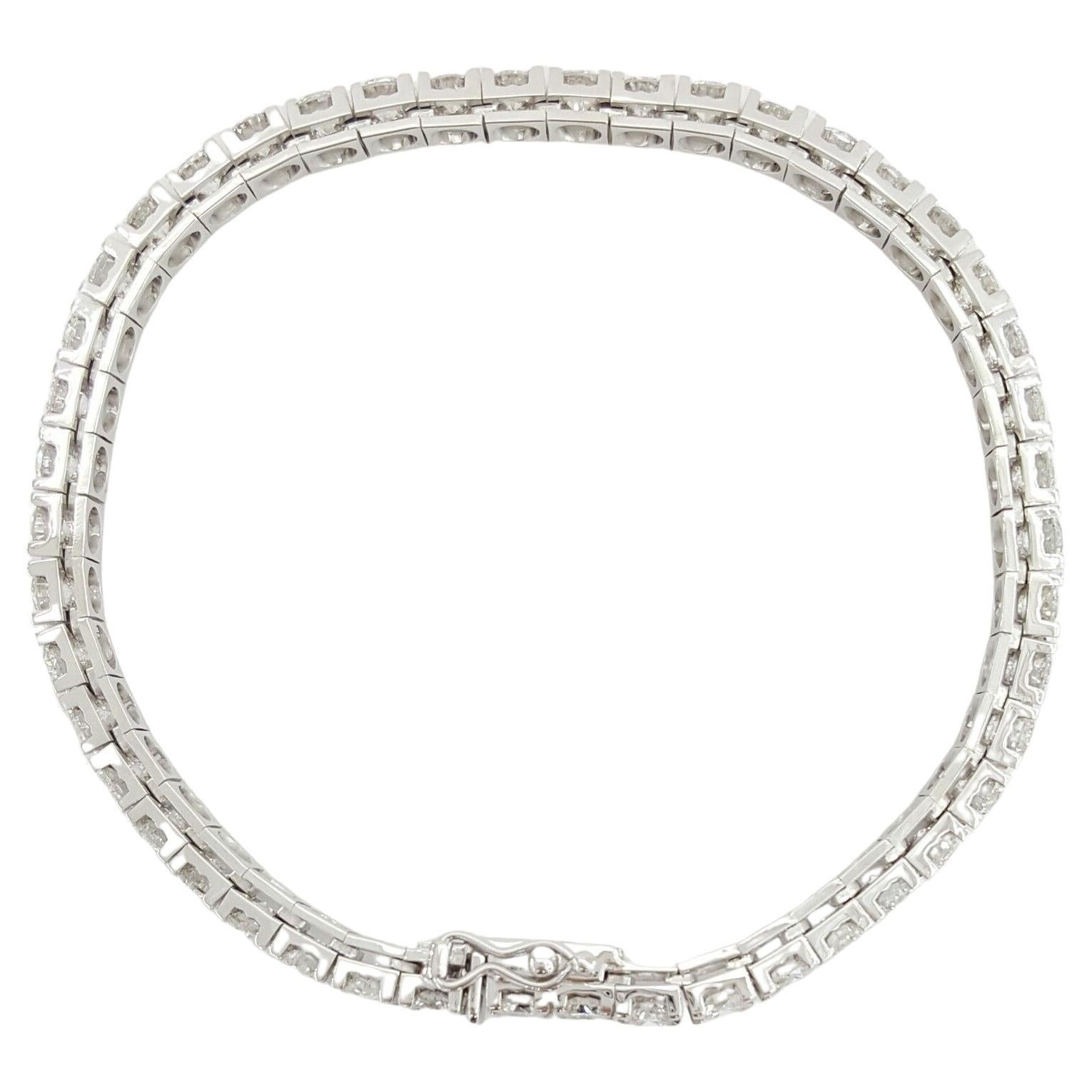  10.86 ct total weight Round Brilliant Cut Diamond Straight Line Tennis Bracelet in 14K White Gold.

The bracelet weighs 16 grams, 7.25