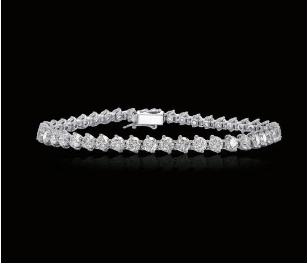  10 Carat tennis bracelet is a piece of jewelry that will grace the hand of a special woman.
The bracelet features dazzling round cut diamonds and mounted on 14K white gold. The handmade bracelet is done with precise goldsmith work. The bracelet has