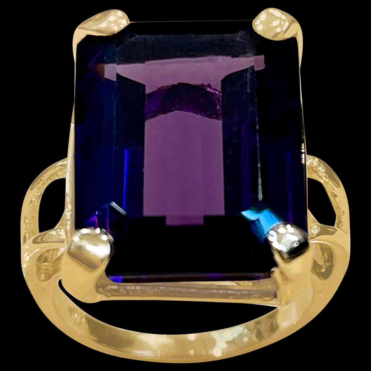 Exact 13.03 Carat Emerald Cut Amethyst  Cocktail Ring in 14 Karat Yellow Gold Size 5.25
17 x 13 MM Amethyst  Cocktail Ring in 14 Karat Yellow Gold 

This is a Beautiful Cocktail ring ring which has a large 13  carat of  Amethyst . Color and clarity