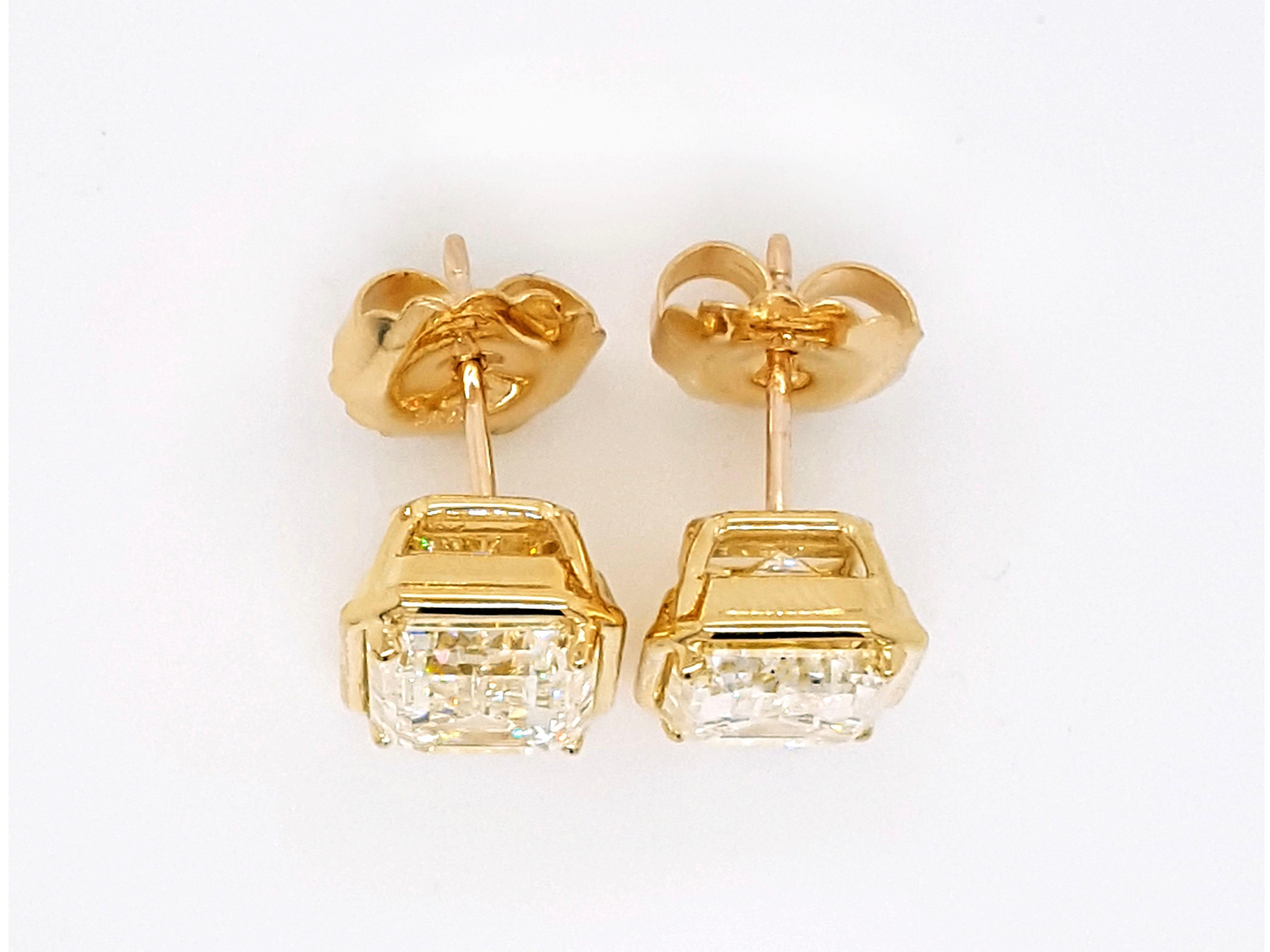 Novel Collection showcasing a stunning pair of bezel-set 10 Carat Emerald Cut Diamond Stud Earrings Set in  18k Gold Bezel, GIA certified, Excellent Polish and Symmetry.
Set with a perfect match of emerald cut 5.01 carat, VVS2 clarity, S-T color GIA