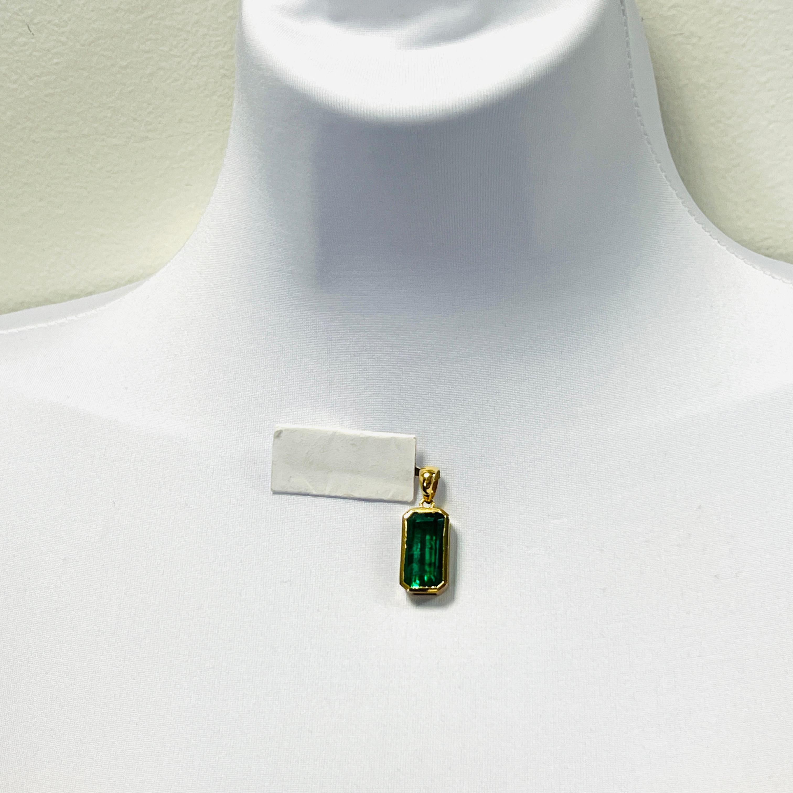 Gorgeous 10.12 ct. emerald cut emerald pendant.  Handmade in 18k yellow gold.