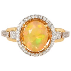 1.0 Carat Ethiopian Opal with Diamond Ring in 18 Karat Yellow Gold