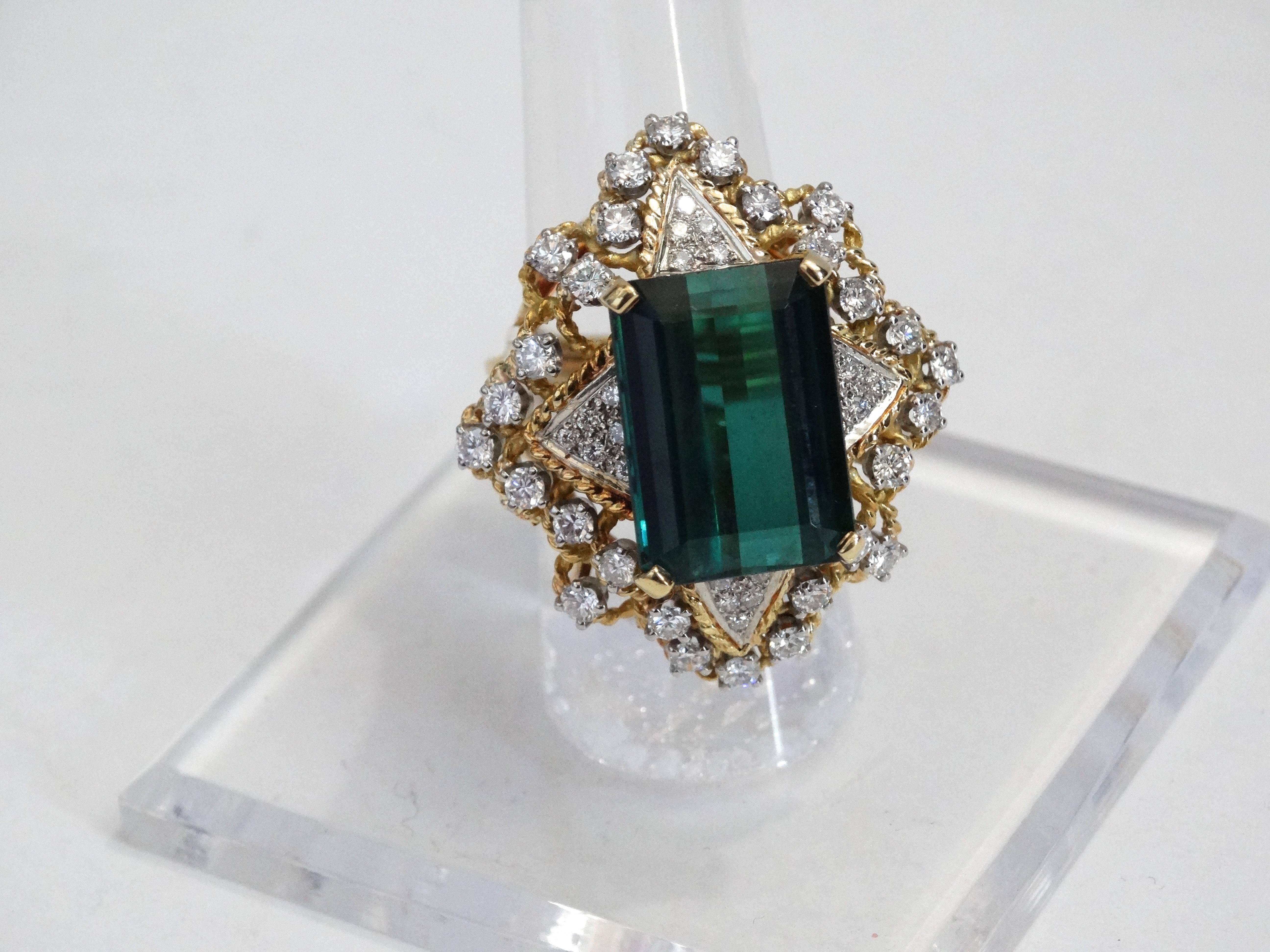 Stunning vintage 10 carat Green Tourmaline Cocktail ring surrounded by 27 Diamonds and 4 < clusters ( Diamond weight is 2 carats total) set in a unique 18 karat gold ring setting, setting has a lovely art deco feel. Tourmaline has a beautiful