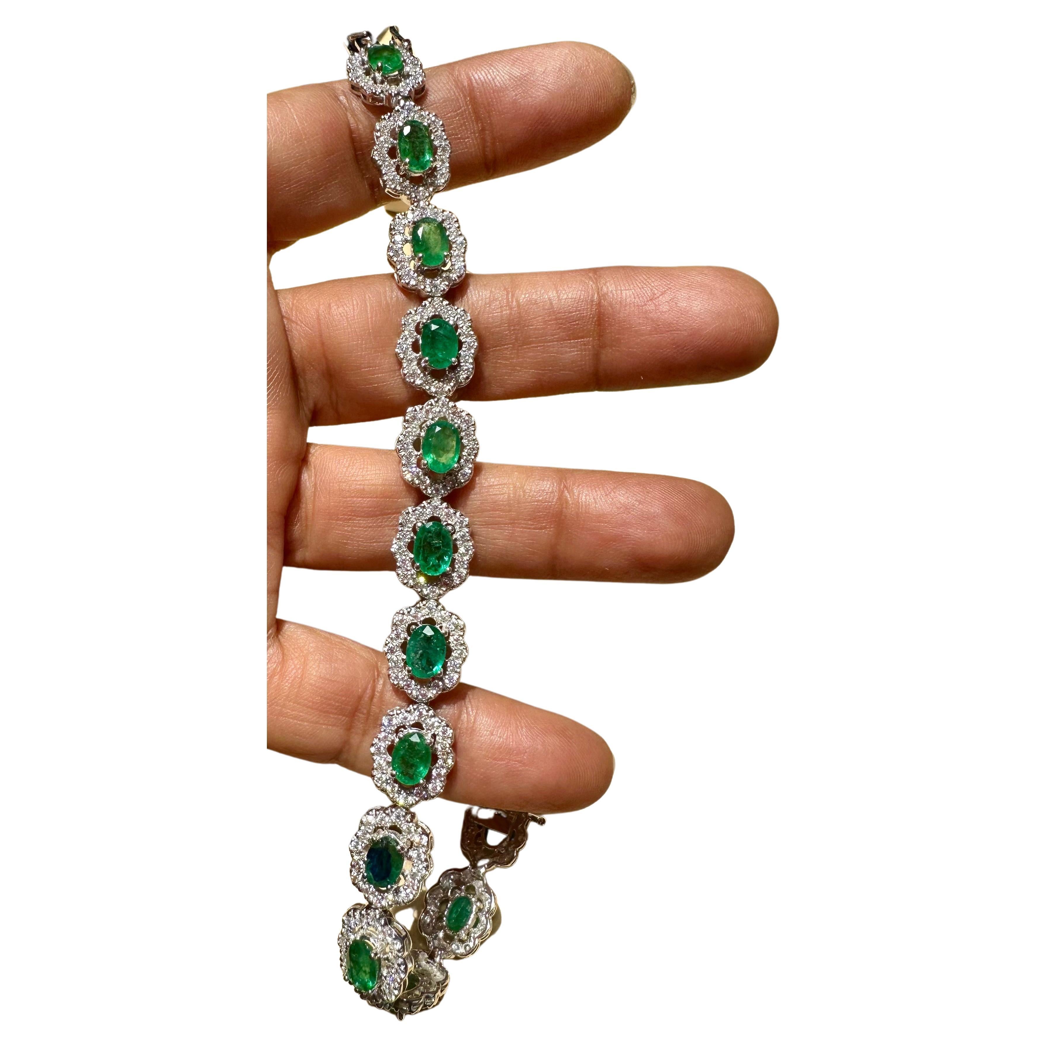 10 Carat Natural Brazilian Emerald & Diamond Tennis Bracelet 14 Karat Gold
 This exceptionally affordable Tennis  bracelet has  13 stones of oval  Emeralds  . Each Emerald is surrounded by  diamonds . Total weight of the Emeralds is  approximately