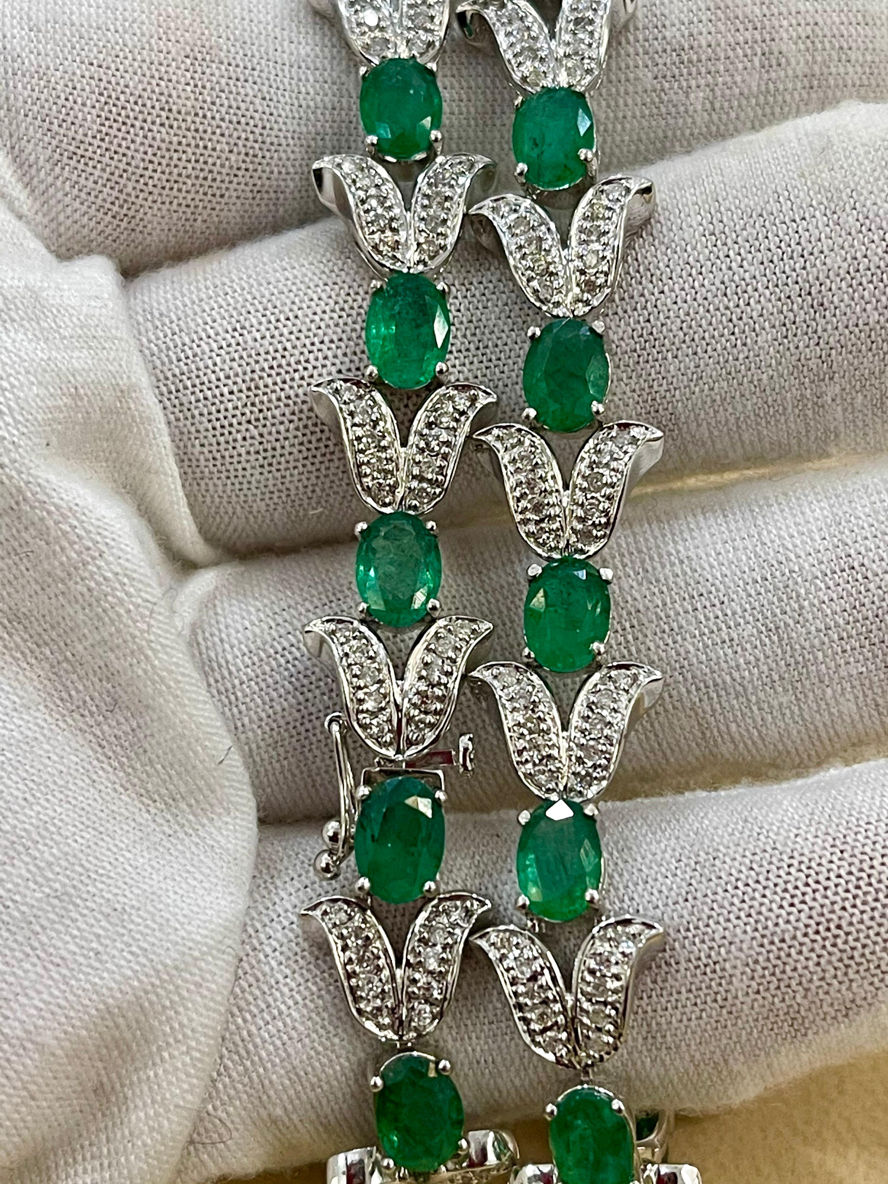  This exceptionally affordable Tennis  bracelet has  12 stones of oval  Emeralds  . Each Emerald is spaced by a V shape bell structure which is mostly white gold but has 10 tiny diamonds.  .Total weight of the Emeralds is  approximately 10  carat.