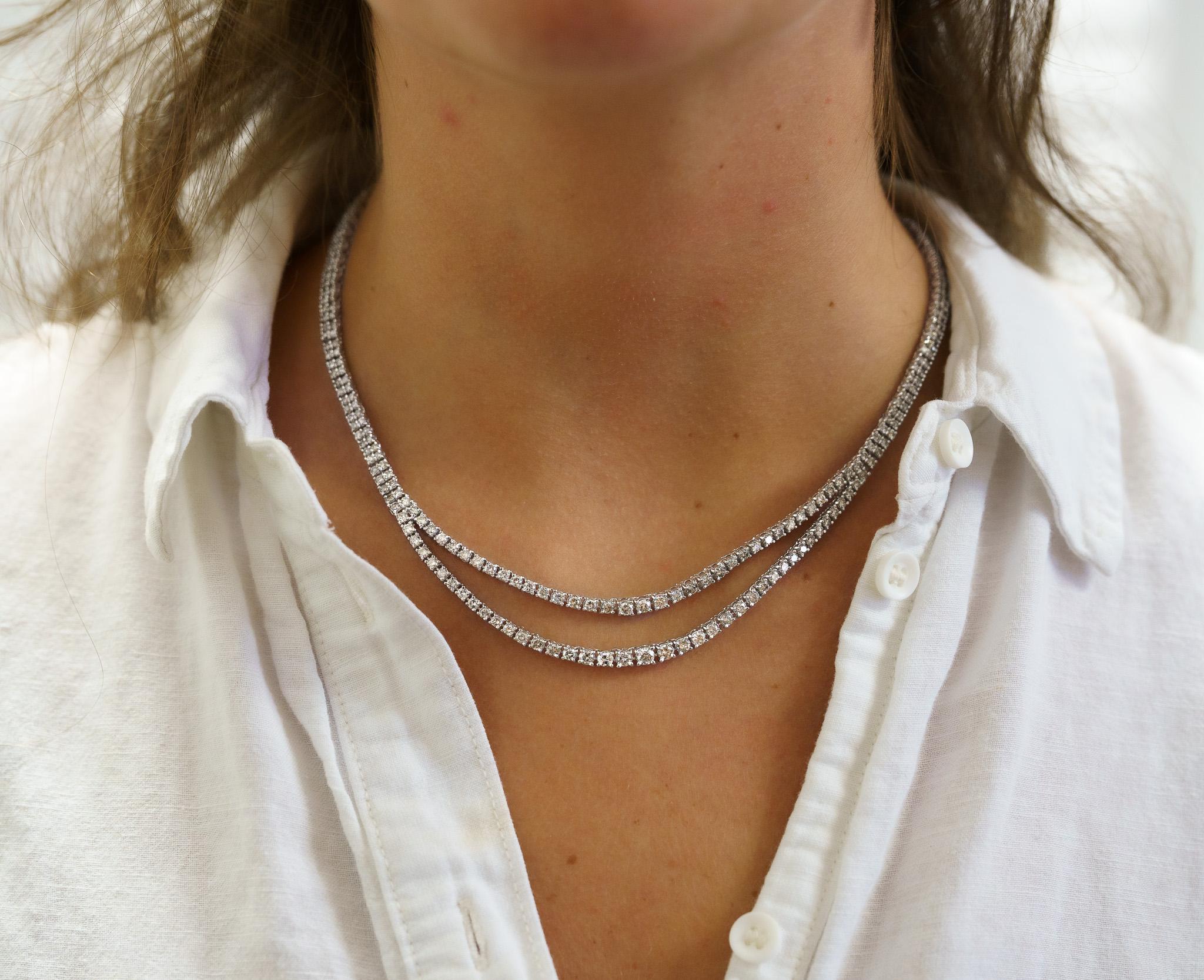 Platinum set 254 piece Round cut 10.10 Carat total natural diamond - 39.20 grams - two strand classic graduated diamond riviera tennis necklace with box and safety latch closure. 4 prong setting. 

A unique twist to the classic tennis necklace. Made