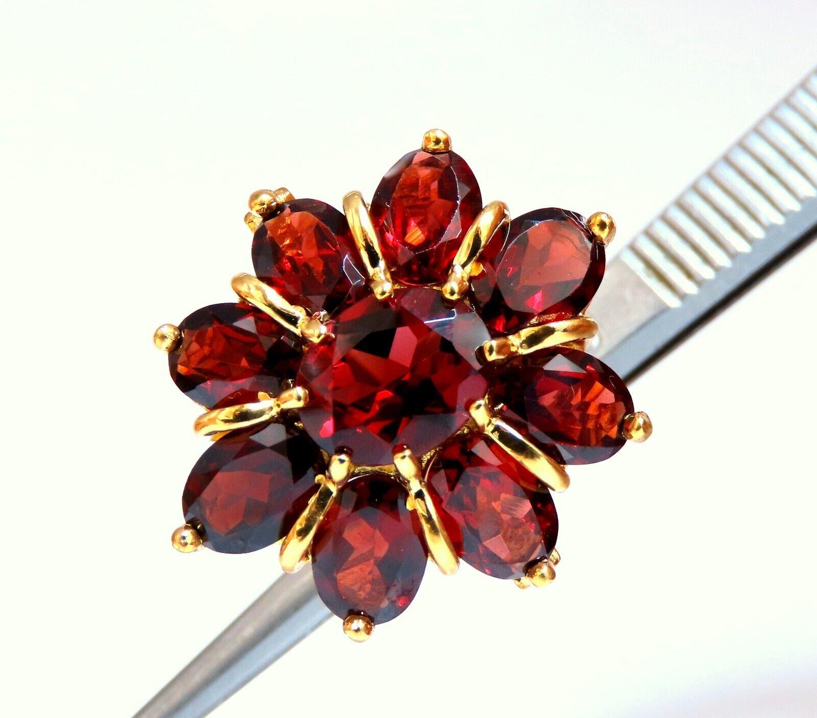 10 carat natural oval-shaped garnets cluster ring.

Clean clarity, crimson red colors.

Deck of ring 23x21 mm

Depth of ring 6 mm

10 karat yellow gold, 5.5 g

Current size 6.75 and we may resize, please inquire.