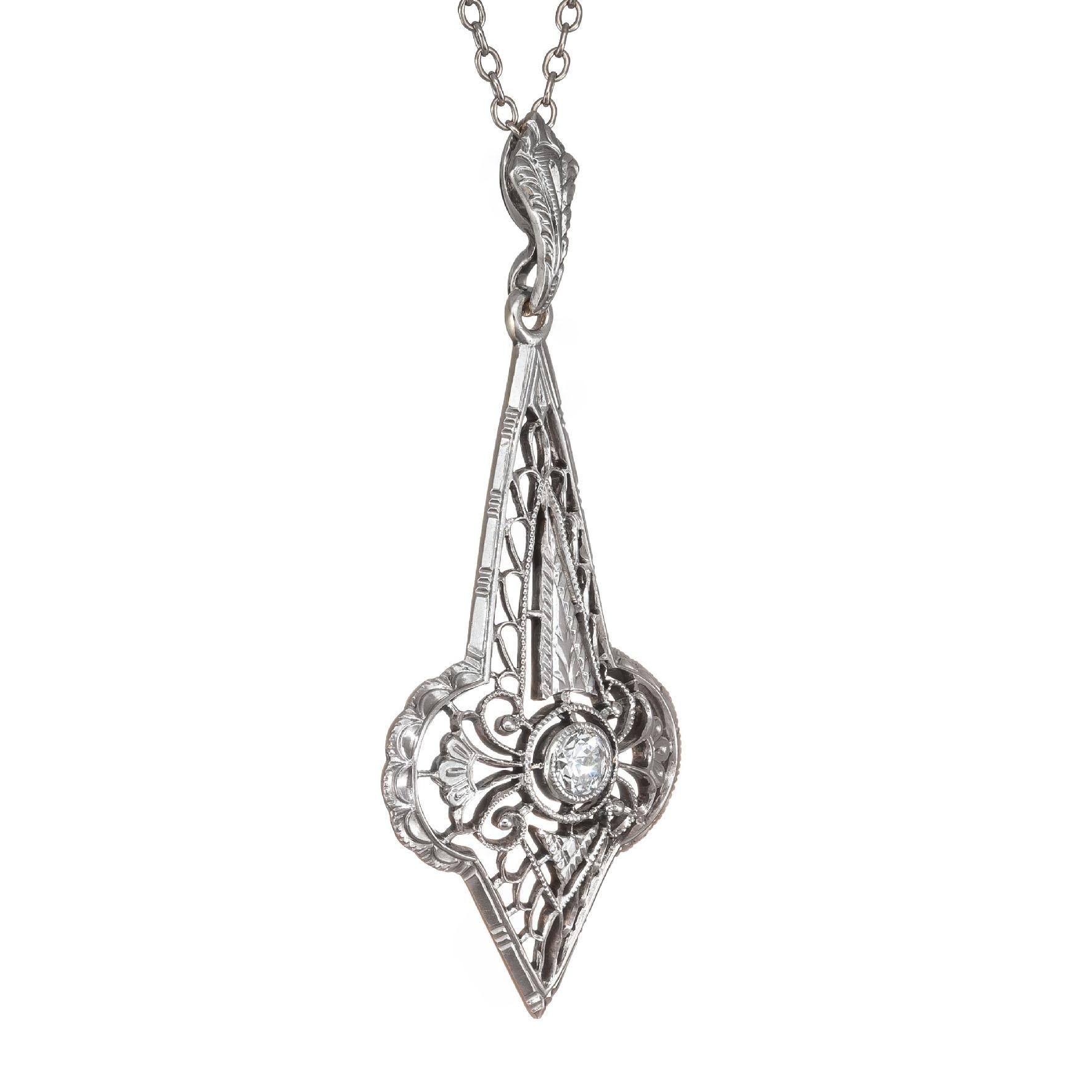 1930's filigree Art Deco pendant necklace. Old Euro center diamond in 14k white gold on a 16 inch 14k white gold chain. Front of the pendant is white gold with a 14k yellow gold back. 

1 old euro diamond approx total weight:  .10cts G, VS2
Chain