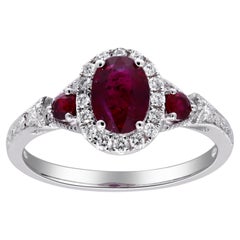 Bague en or blanc 14 carats avec diamants de 1,0 carat de taille ovale et rubis de 0,15 carat de taille ronde