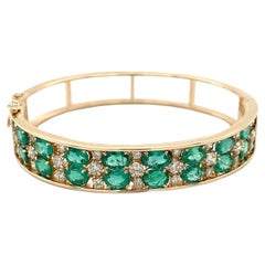 Brazalete de oro estilo jaula de 2 filas de esmeraldas naturales talla oval de 10 quilates en oro de 14k