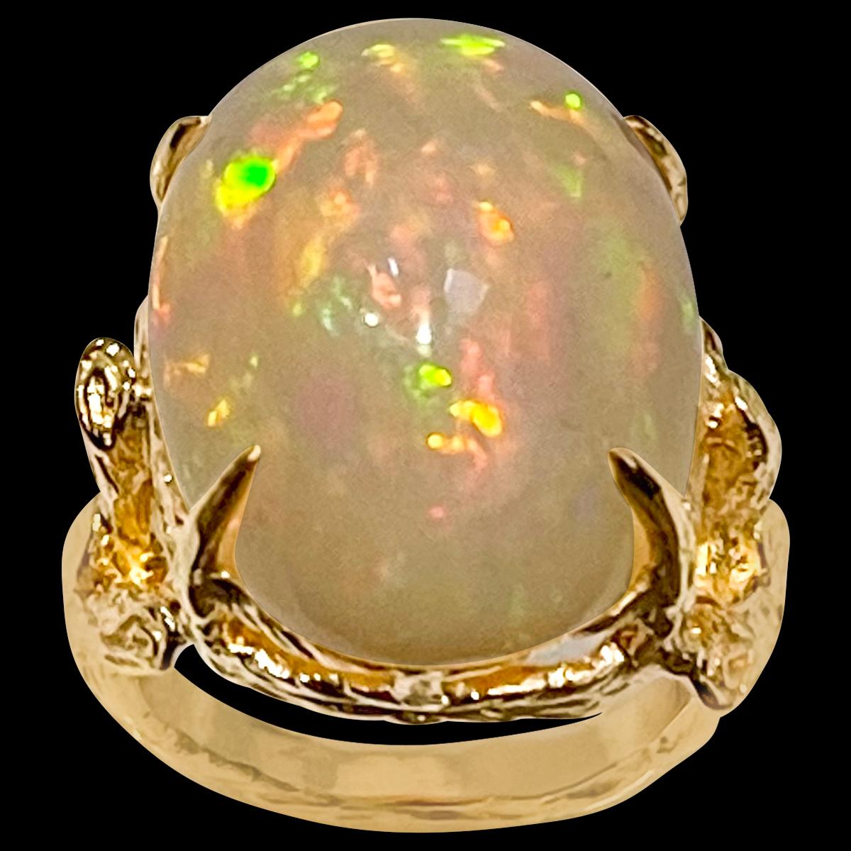 approximately 10 Carat Oval Shape Ethiopian Opal Cocktail Ring 14 Karat Yellow Gold size 5
Oval  Natural Opal  A classic, Cocktail ring 
14 Karat Yellow Gold Estate
Size of the opal 18 X 16 MM, Approximately 10 Ct
Amazing colors in this opal and a