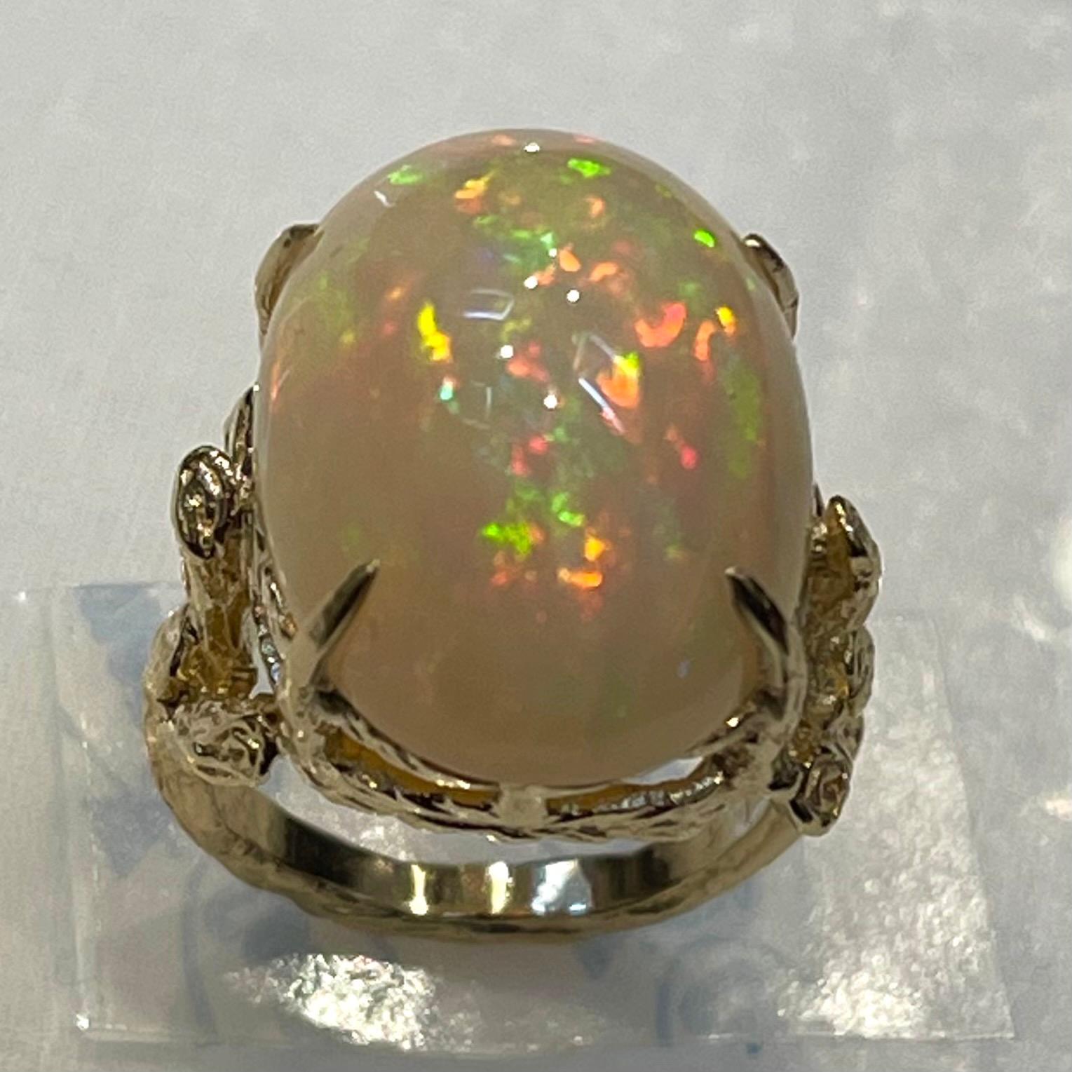 10 Carat Oval Shape Ethiopian Opal Cocktail Ring 14 Karat Yellow Gold In Excellent Condition For Sale In New York, NY