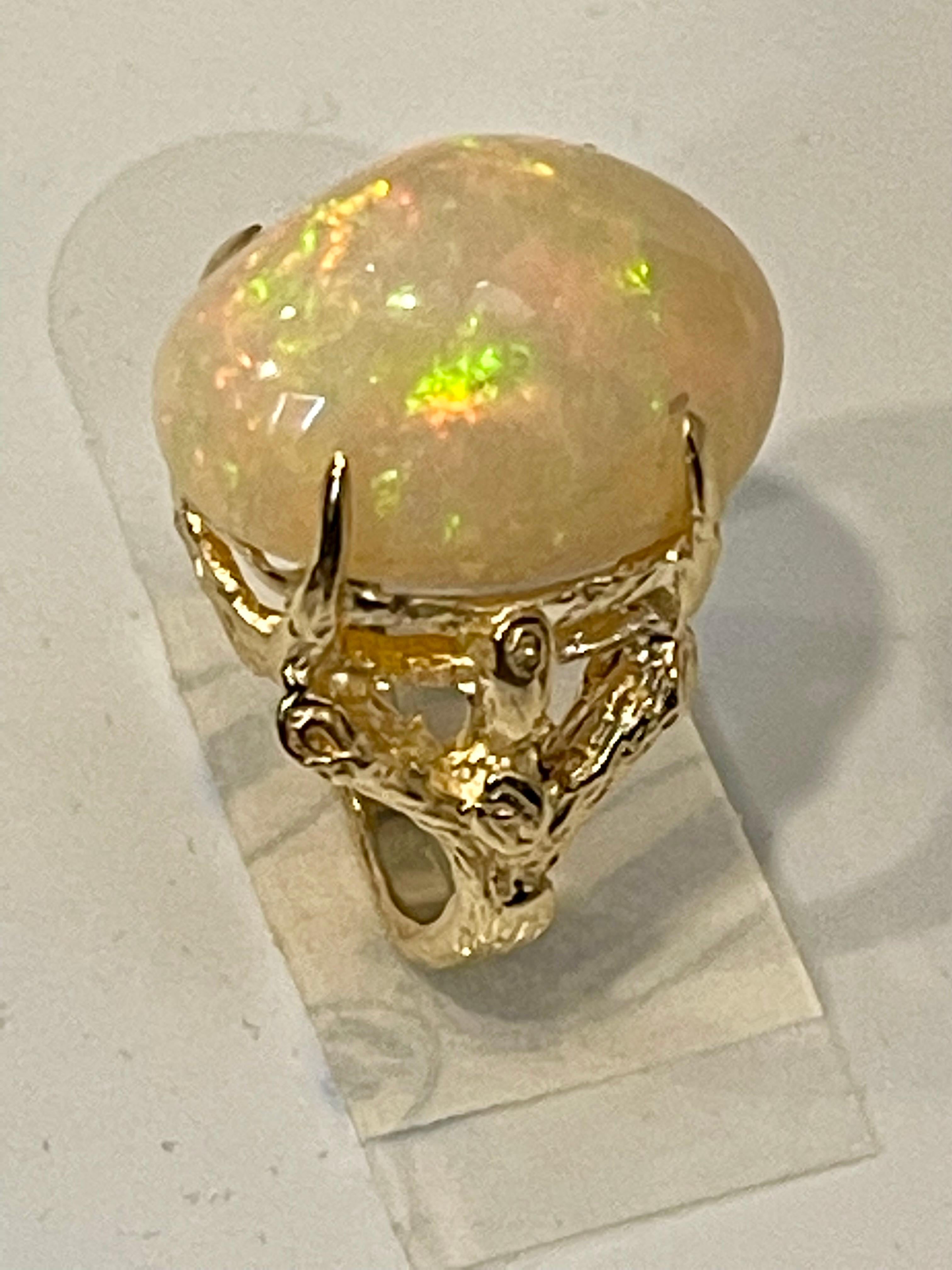 Women's 10 Carat Oval Shape Ethiopian Opal Cocktail Ring 14 Karat Yellow Gold For Sale
