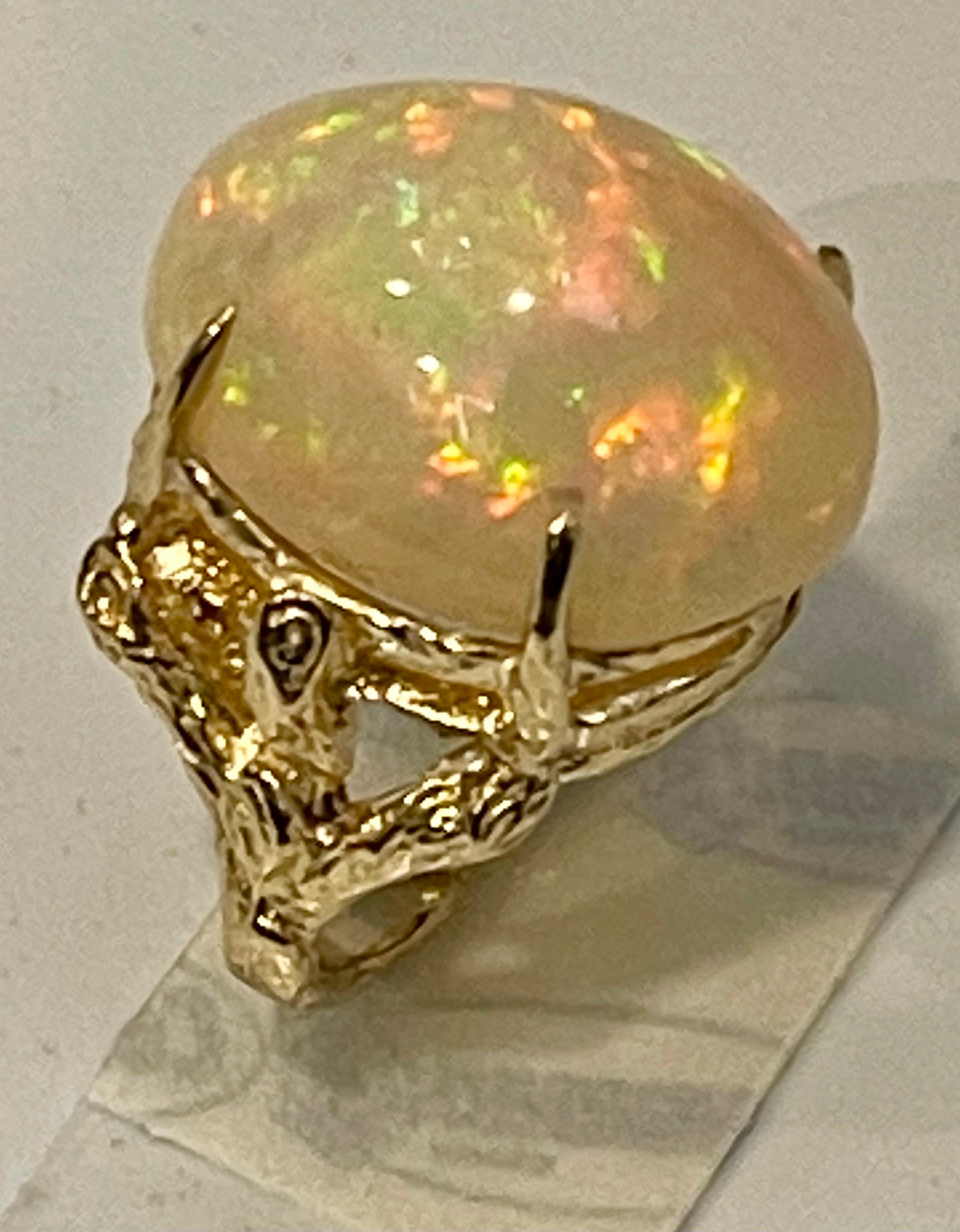 10 Carat Oval Shape Ethiopian Opal Cocktail Ring 14 Karat Yellow Gold For Sale 1