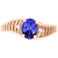 1.0 Carat Oval Shaped Tanzanite and 0.03 Carat White Diamond Ring