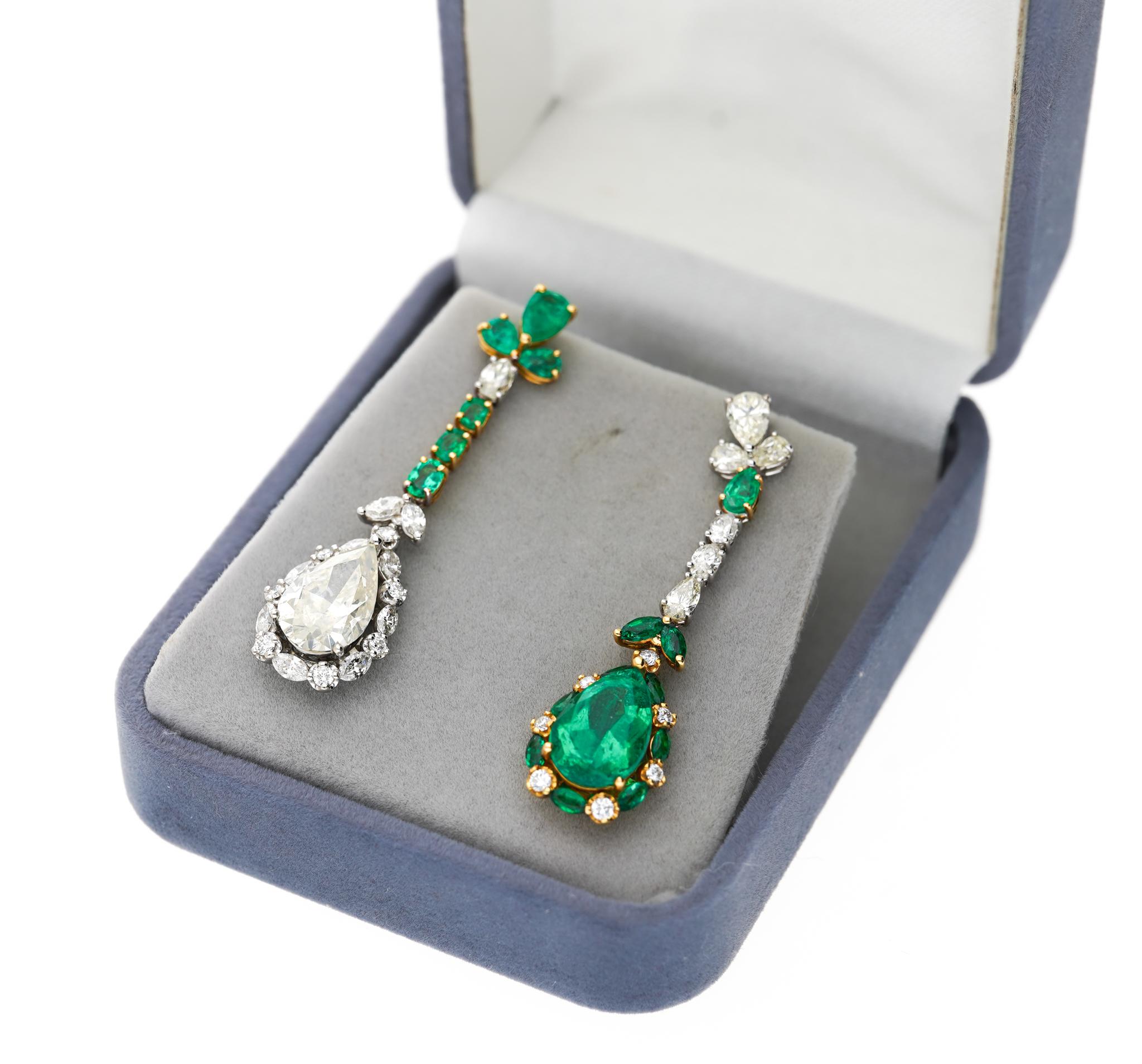 18 karat two-tone solid gold mounts these one-of-a-kind mirrored opposites emerald and diamond drop earrings. Featuring a natural 2.93-carat pear cut Colombian emerald and 3.01 carat natural pear cut diamond center stone on each earring.