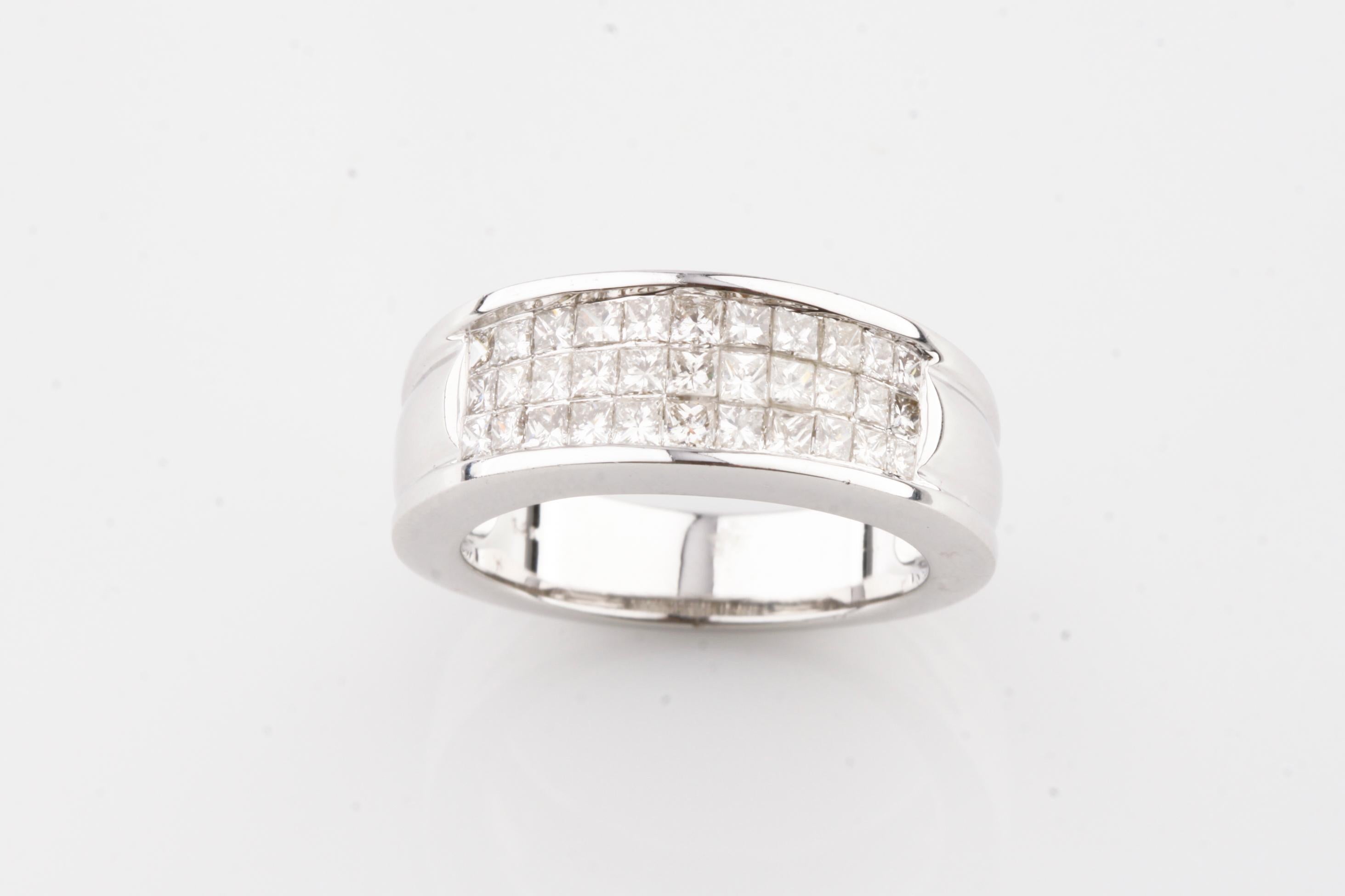 Gorgeous 14k White Gold Band Ring
Features Plaque of Invisible Set Princess Cut Stones
Total Diamond Weight = 1.0 ct
Width of Ring at Front = 8 mm
Width of Band at Reverse = 3 mm
Total Mass = 8.5 grams
Size 6.75
Gorgeous Ring!