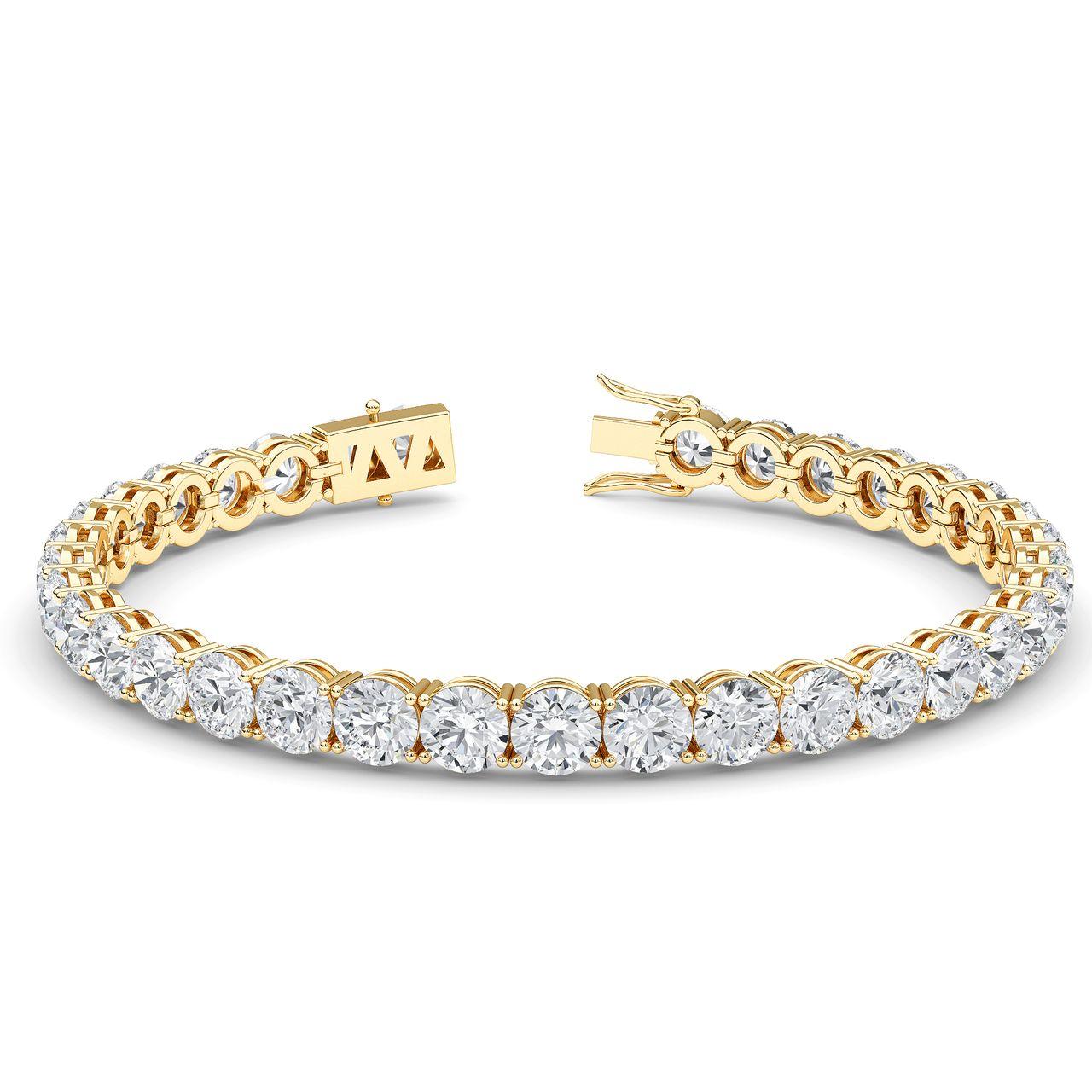 Ce bracelet de tennis exquis est une véritable pièce d'apparat, mettant en vedette un total de 36 éblouissants diamants ronds de taille brillante naturels sertis dans une riche monture en or jaune 14 carats. Voici les détails captivants :
Poids