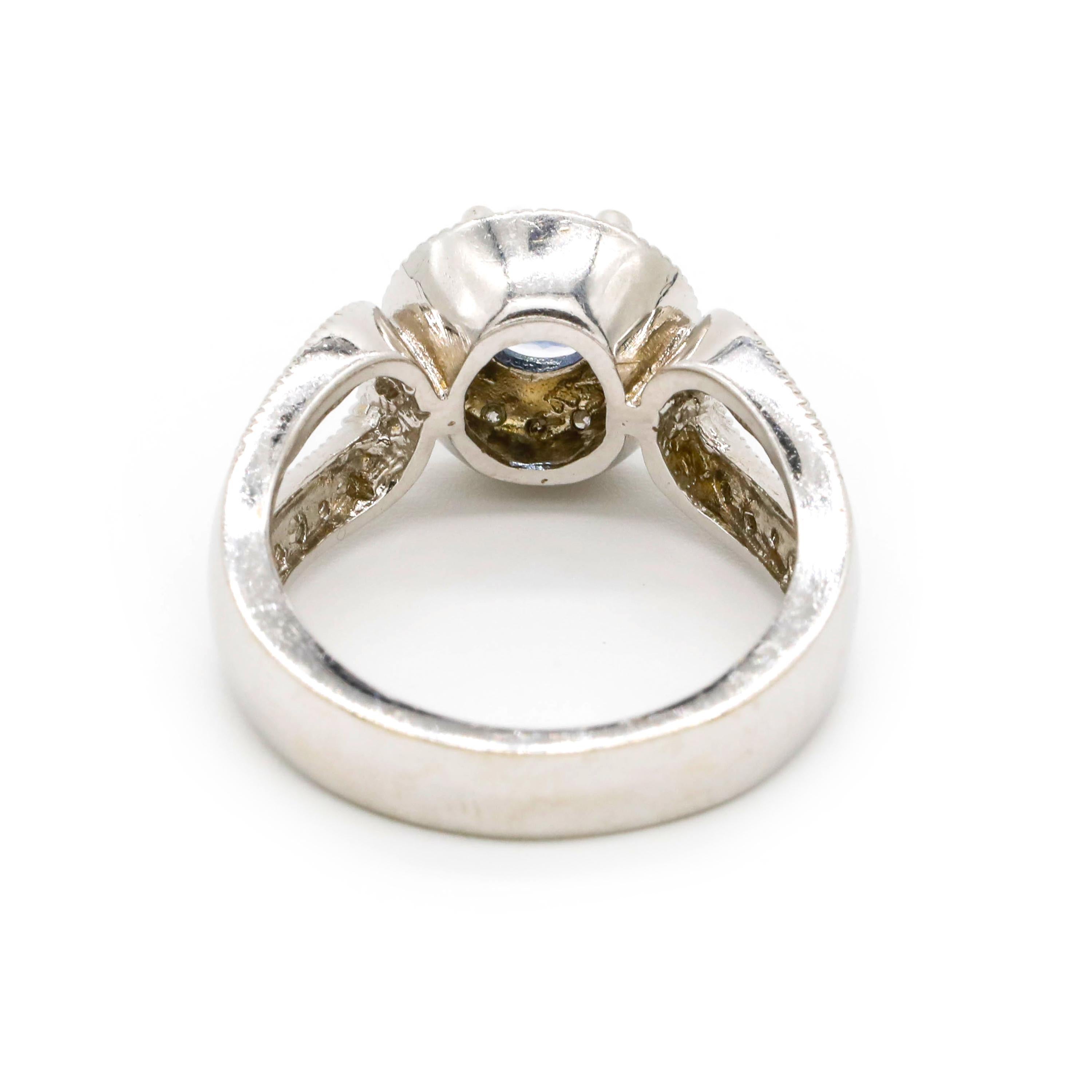 Romantic 1.0 Carat Round Tanzanite 0.50 Carat Diamond 14 Karat White Gold Fine Halo Ring For Sale