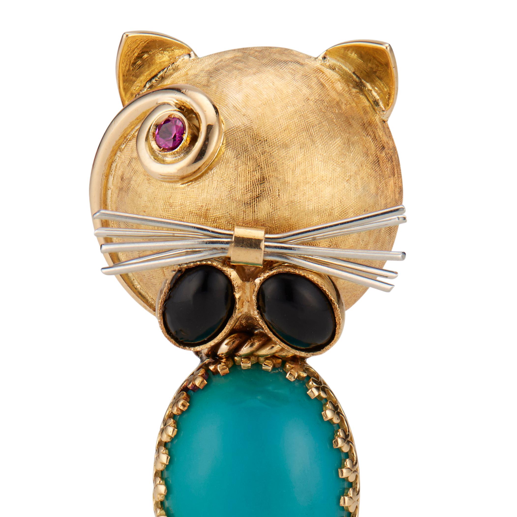 1950's handmade mid-century cat brooch. Oval Persian turquoise with 2 oval onyx and one ruby key set in 18k yellow gold. 18 White gold whiskers.   

2 oval cabochon onyx 6mm x 4mm
1 oval cabochon turquoise 17mm x 12mm
 1 round ruby approx. total