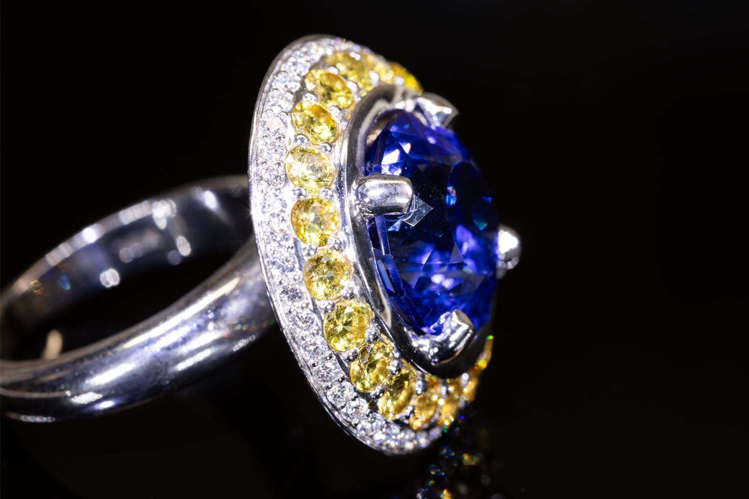 Women's 10 Carat Tanzanite Cocktail Ring in 18K WG with Yellow Sapphires & Diamond Halo For Sale