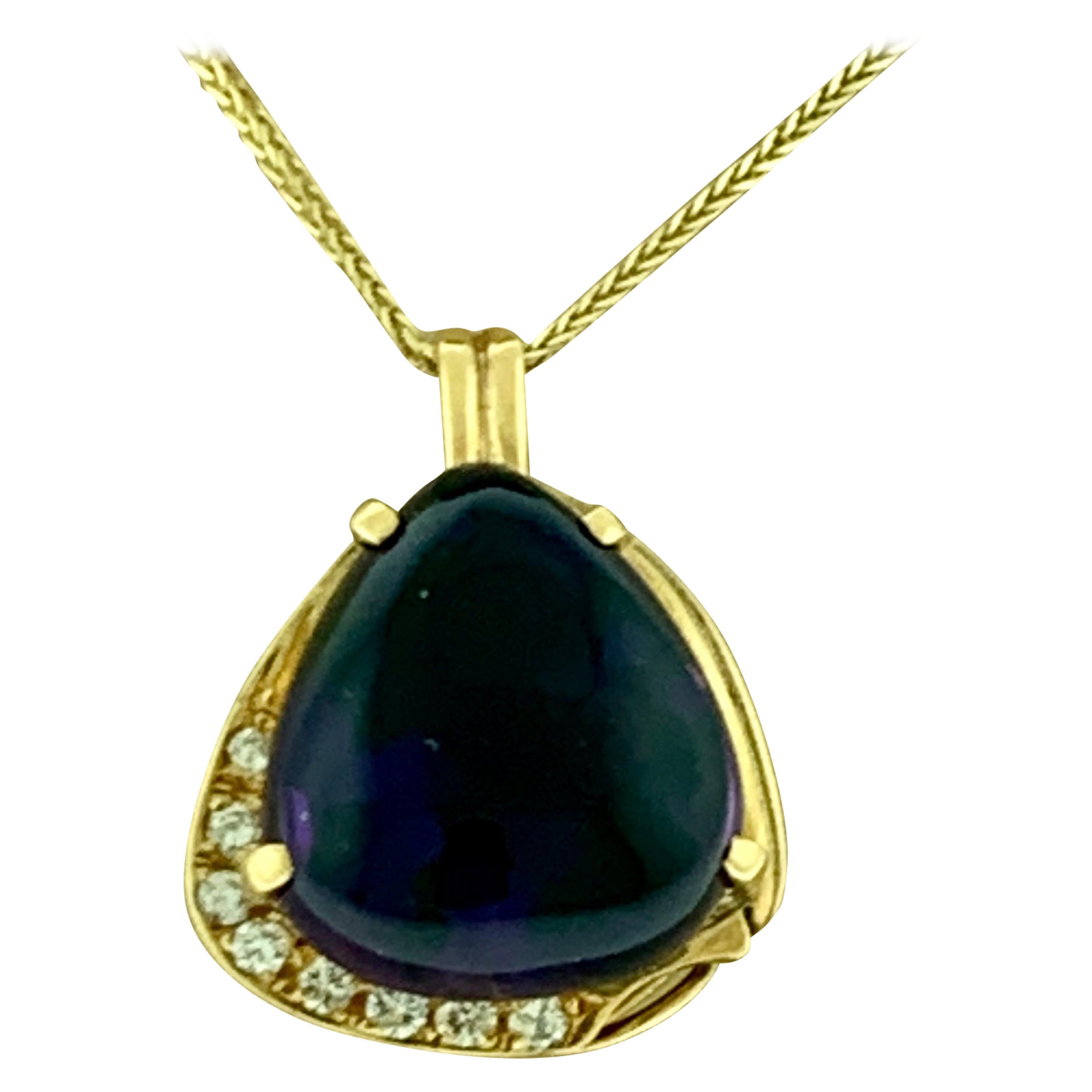Approximately 10 Carat  Tear Drop Amethyst & Diamonds Pendent 18 K yellow Gold
Amethyst is 17 mm X 15mm approximately 10 ct
16 inch 14 K gold Chain is 1.5 grams
Weight of 18 Karat gold pendent is 6.6 Grams
This extraordinary Necklace is 10 carats