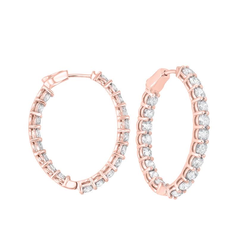 Nothing says luxury like an incredible pair of diamond hoop earrings. These stunning brightly polished 14 karat rose gold inside out oval-shaped hoop earrings feature a total of 42 round brilliant cut diamonds totaling 10.00 carats are prong set on