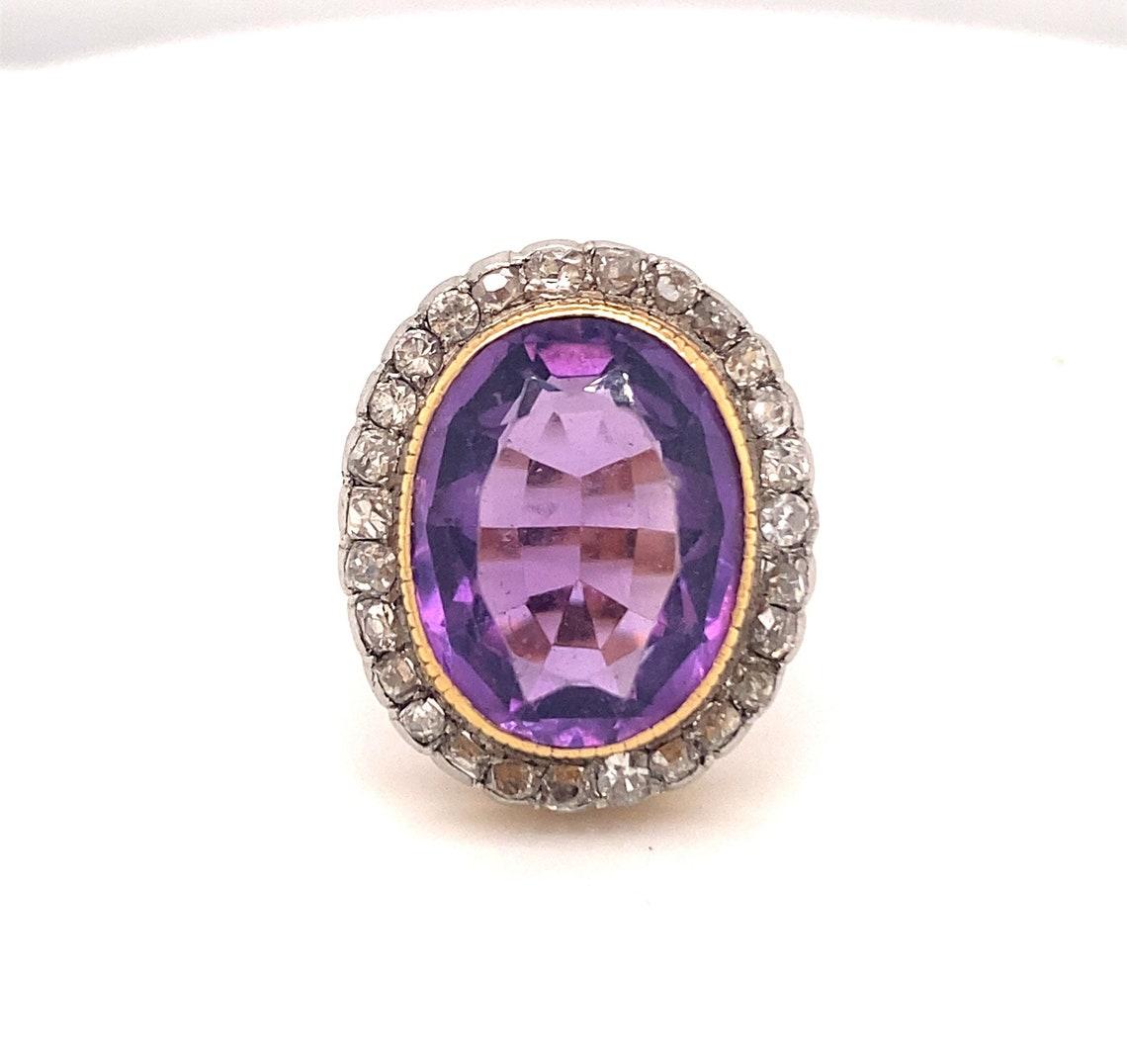 
10 Carat Vintage Amethyst Diamond Ring 18 Karat Yellow Gold with 31 Diamonds 

. This is a beautiful antique Edwardian 10 carat amethyst diamond ring. The ring is set with 28 old mine cut diamonds . The diamonds average I color IS-1 clarity with a