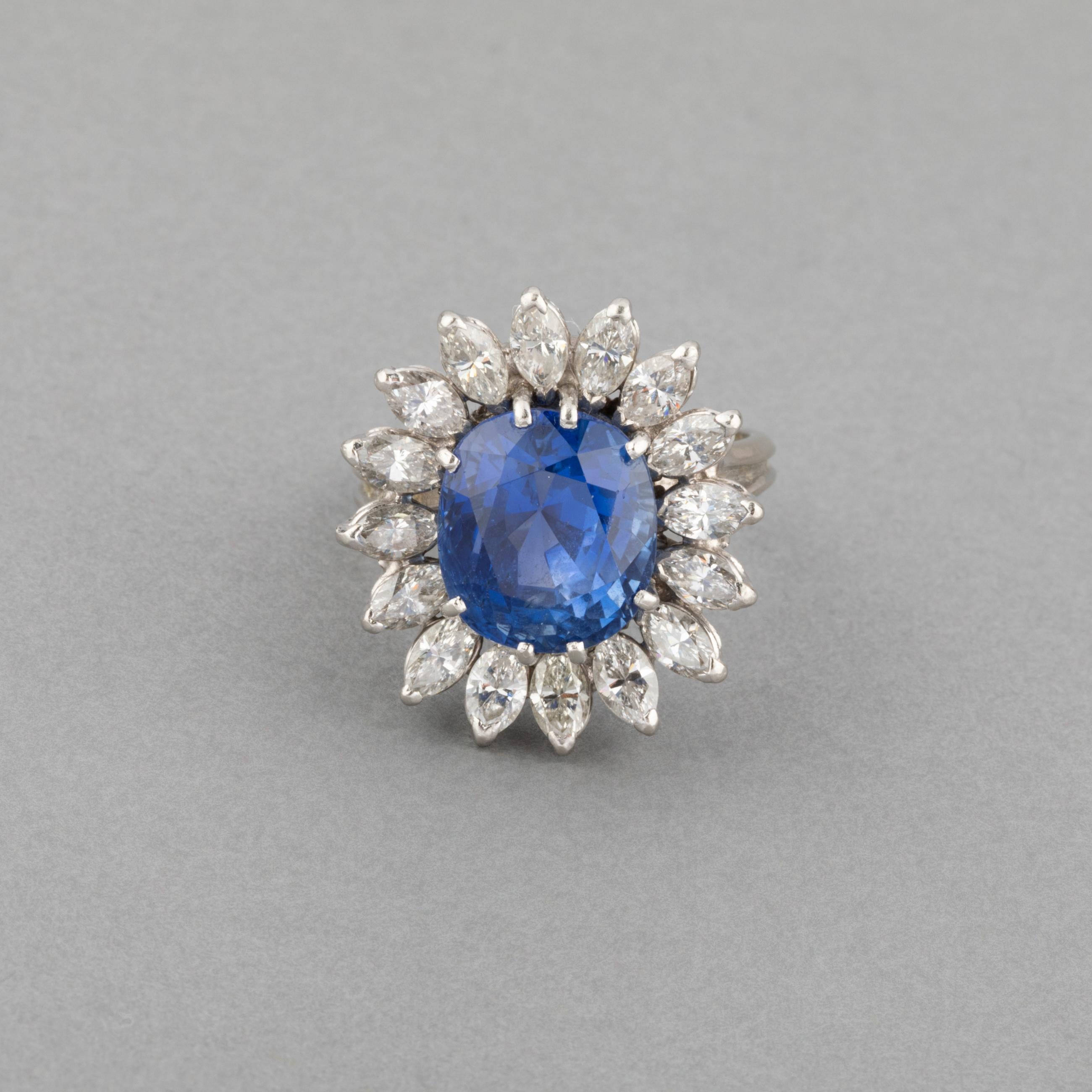 A very beautiful ring, made in France circa 1970.

French hallmark for platinum.

The sapphire has intense blue color and weights approximately 10 carats. Surround by 2 carats of diamonds.

The Certificate is pending.

Dimensions: 22 and 20 mm for